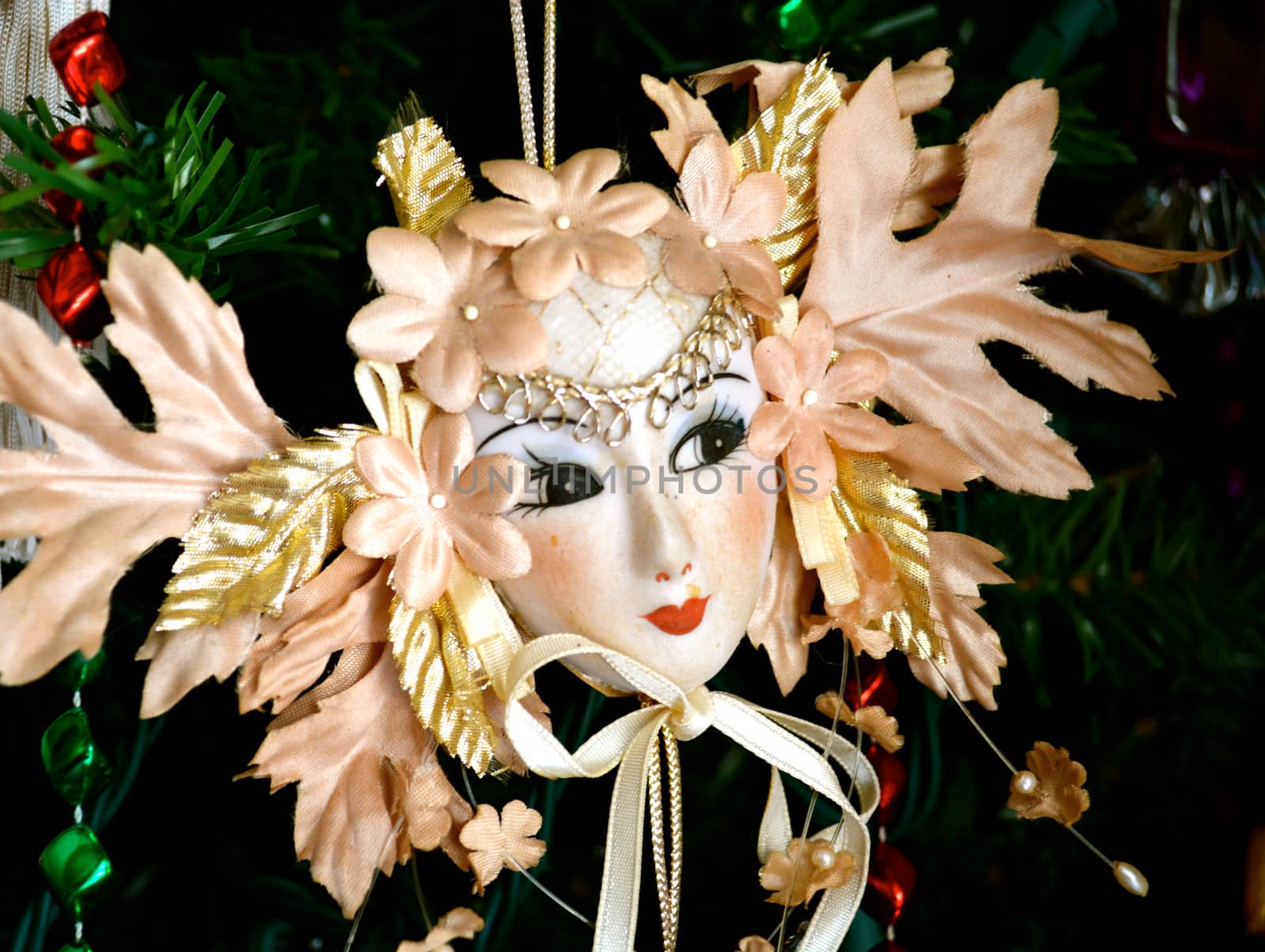 Theatre Mask Ornament hangs on Christmas Tree