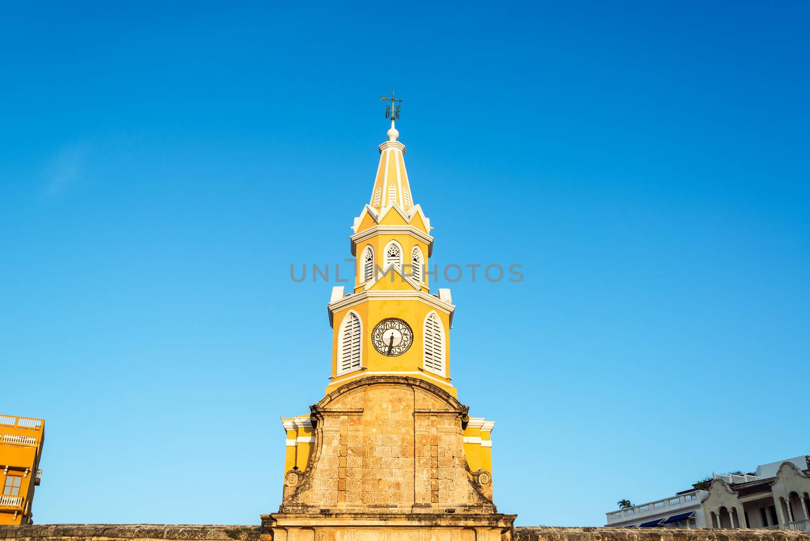 The yellow clock tower marking the entrance to the old town of Cartagena, Colombia