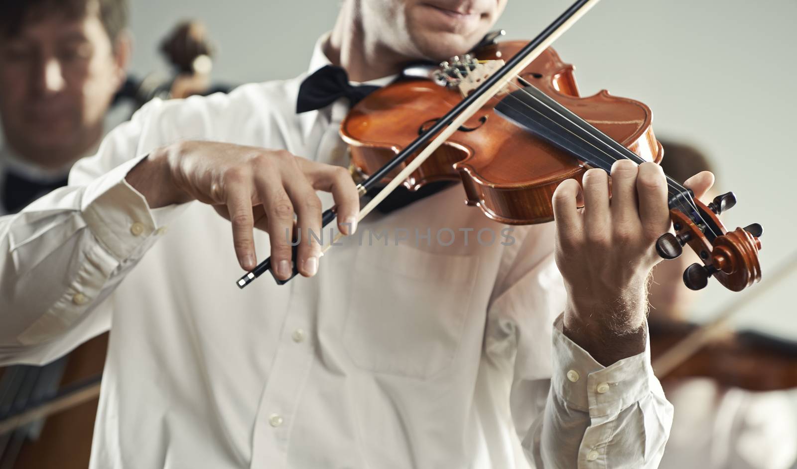Classical music: Violinist playing at the concert