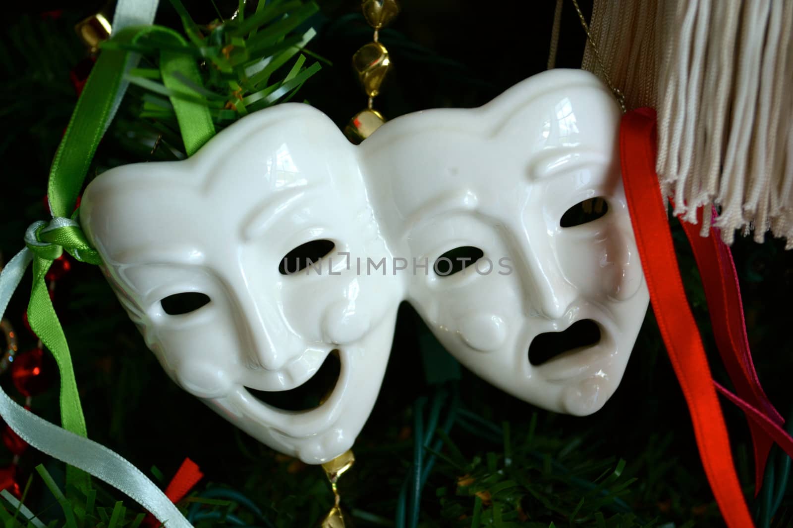 Theatre Mask Ornament hangs on a Christmas Tree