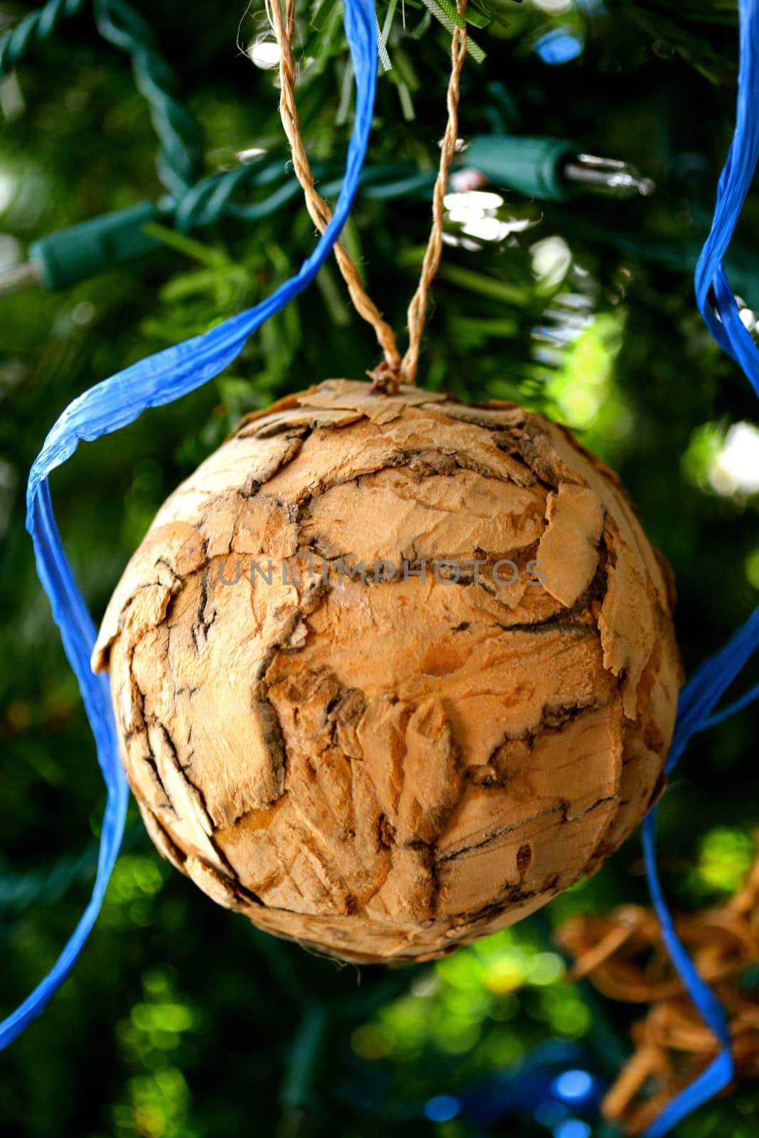 Wooden Ornament hangs on a Christmas Tree