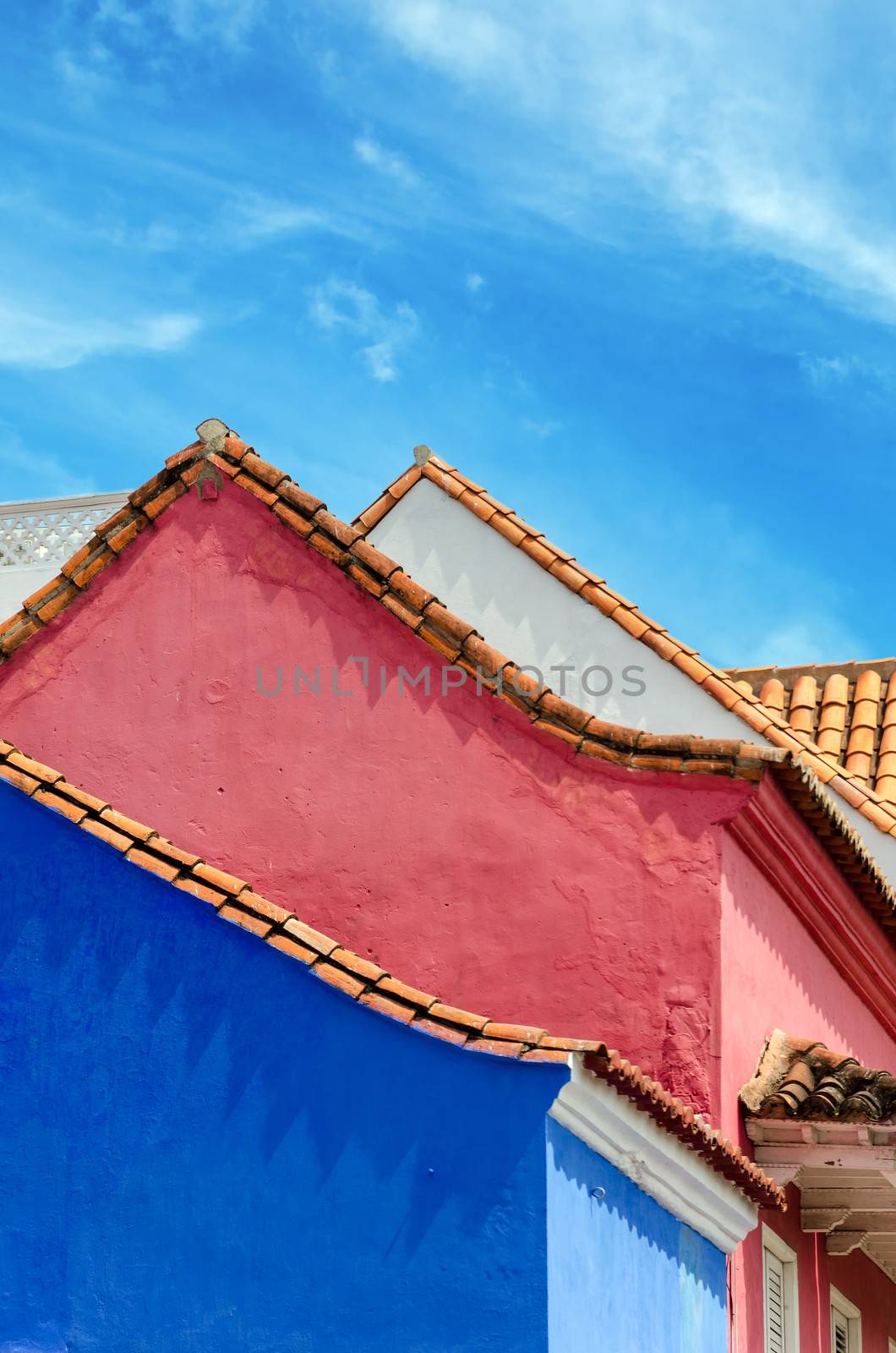 Blue, pink, and white colonial buildings in the old town of Cartagena, Colombia