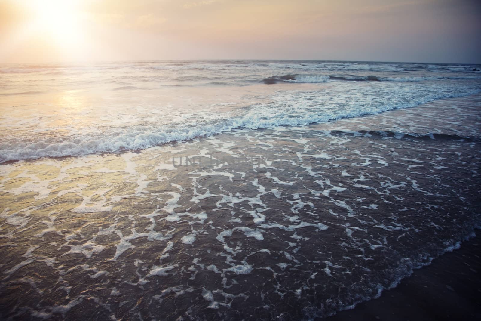 Horizontal photo of the sea during late sunset. Special dramatic darkness