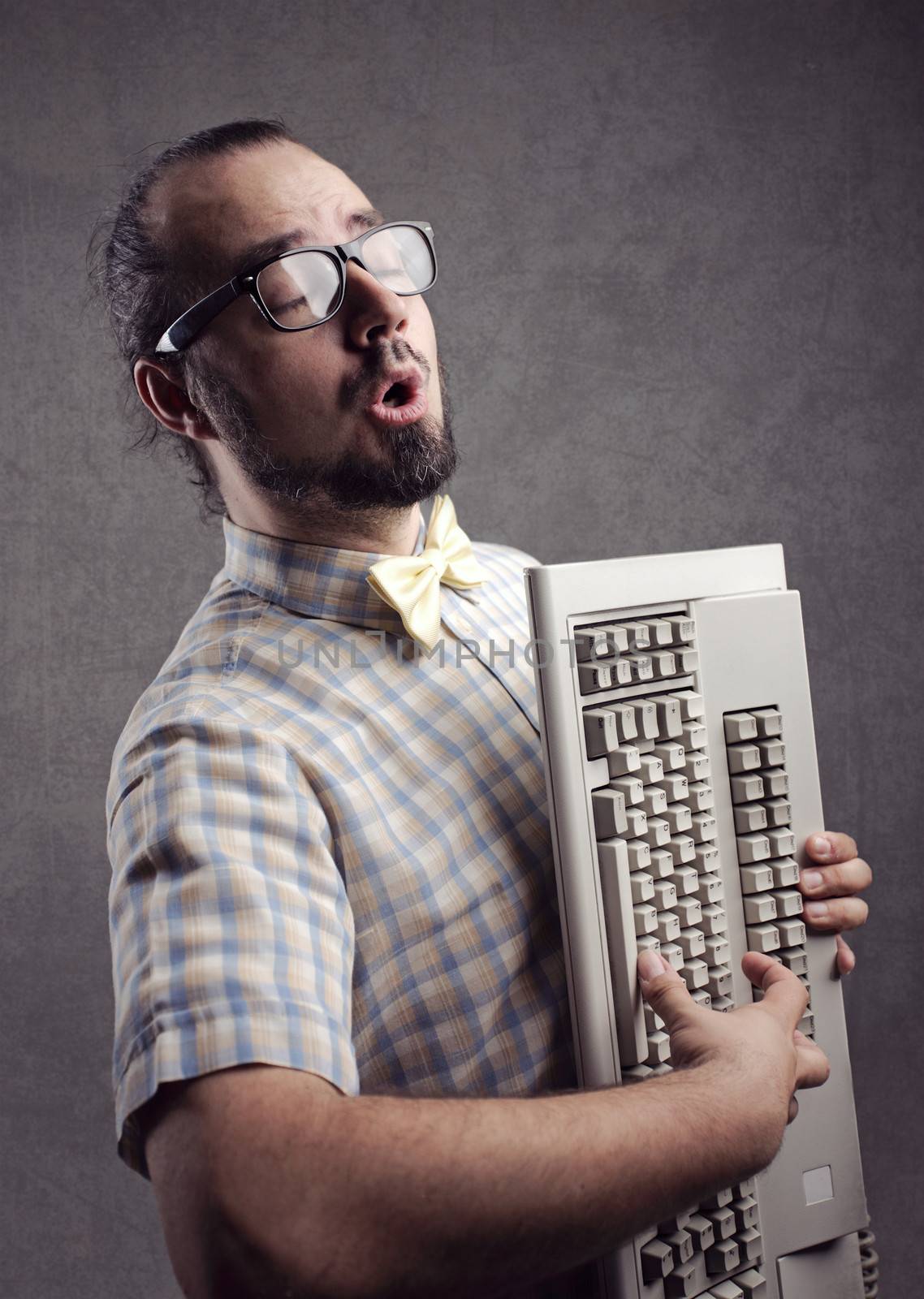 Funny man playing with a keyboard 