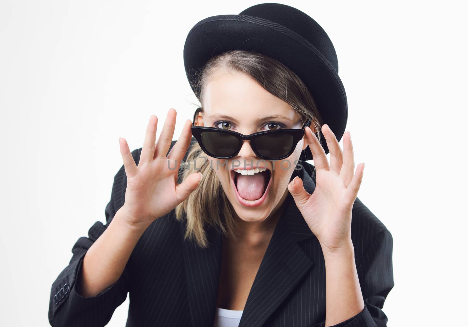 Excited blonde girl wearing sunglasses on white background