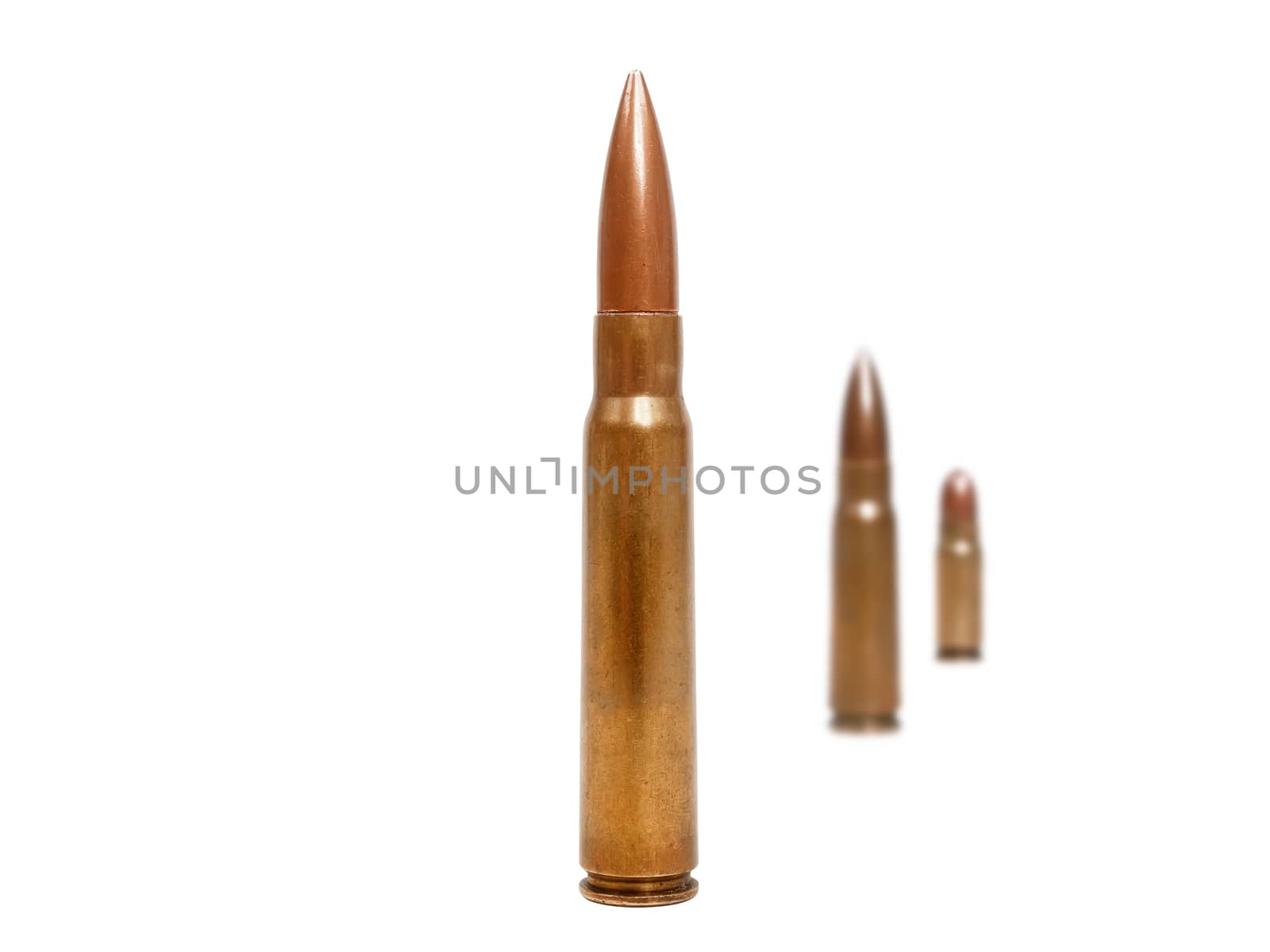 three bullets, two of them blurred deep in background