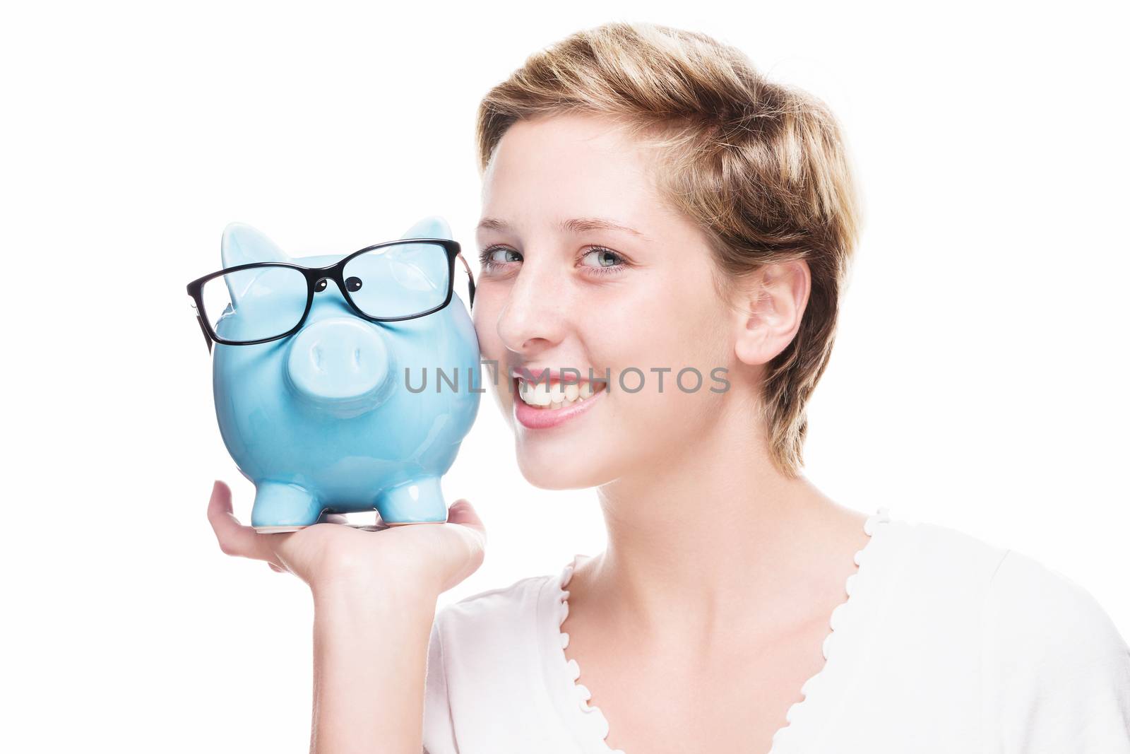 cute woman cuddling with a piggy bank on white background
