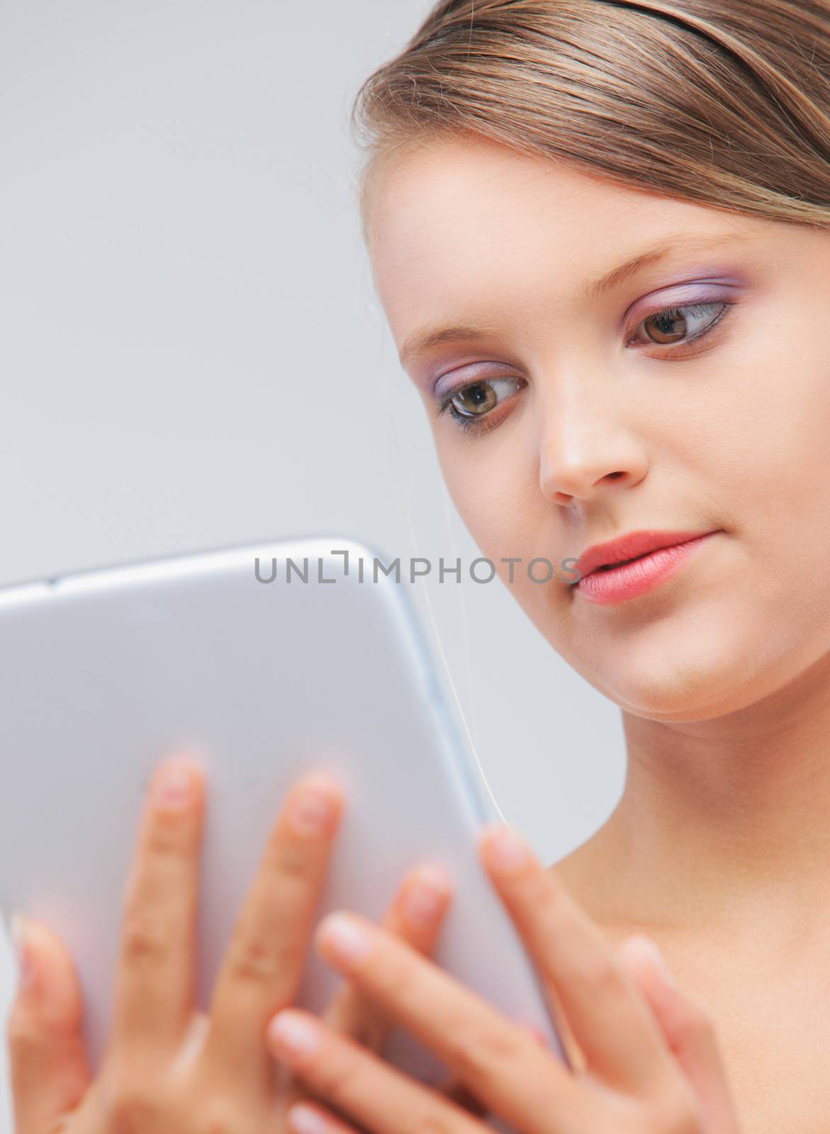 Portrait of beautiful girl with her digital tablet