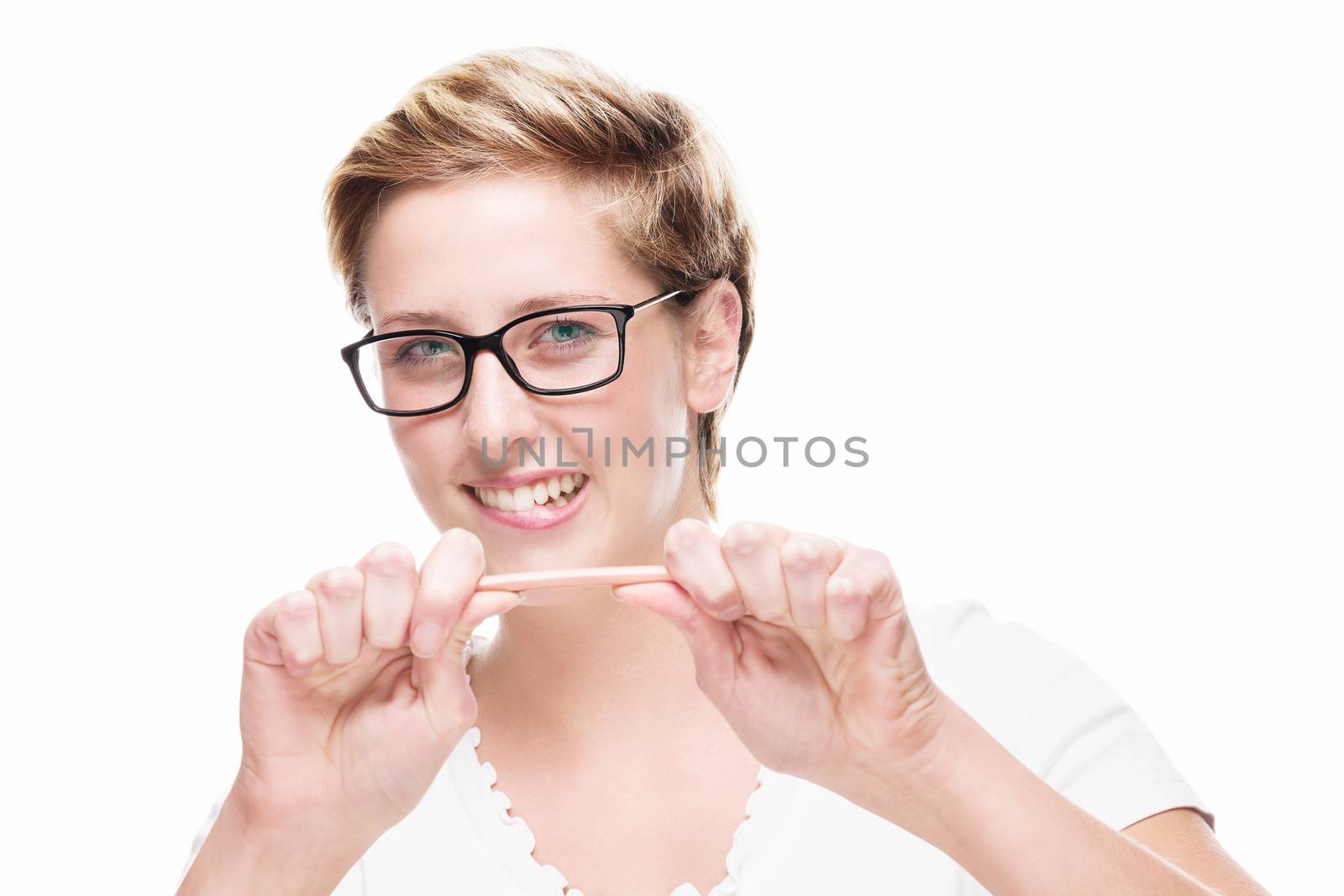 young blonde woman trying to break her pencil on white background