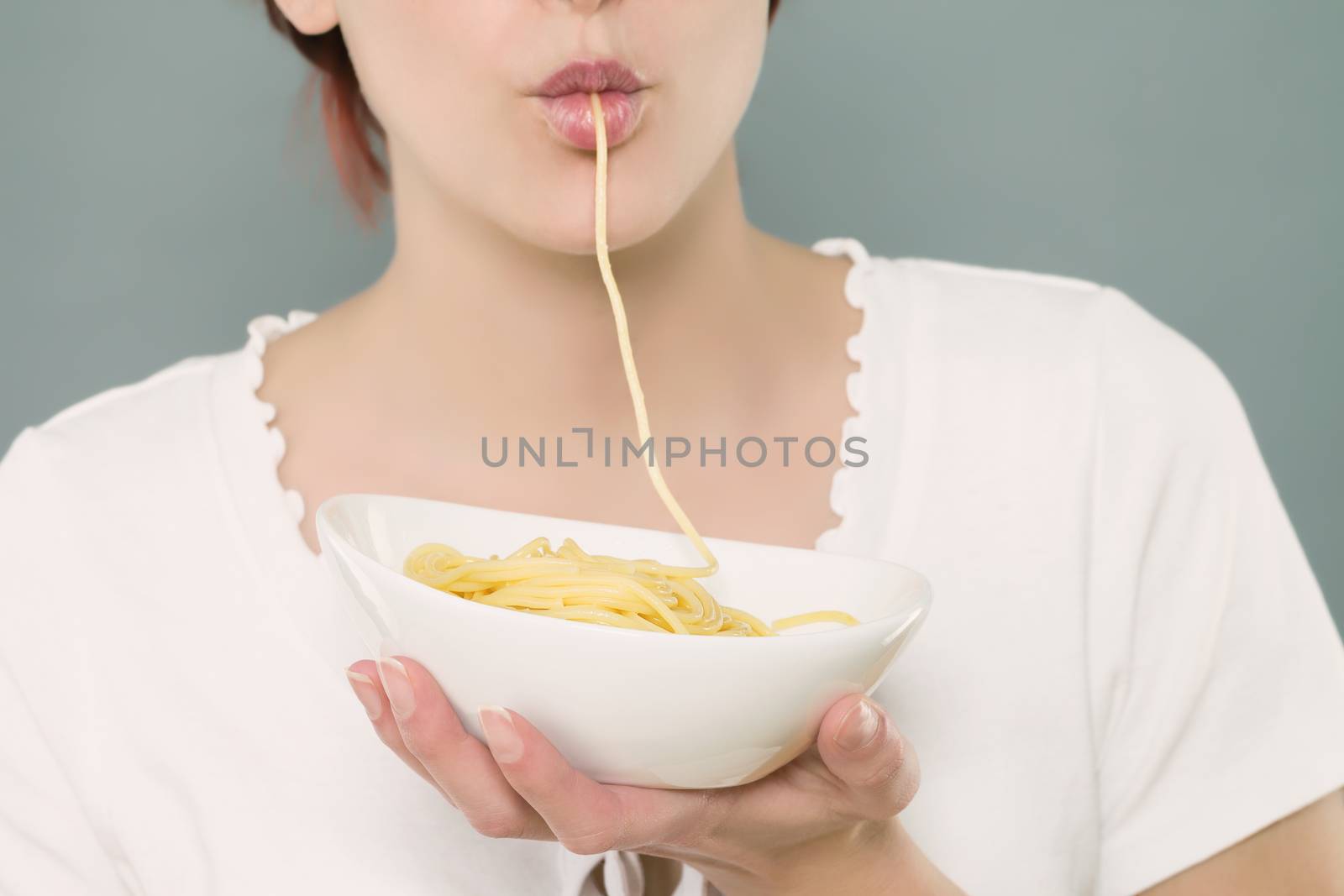 mouth closeup of a woman sucking spaghetti