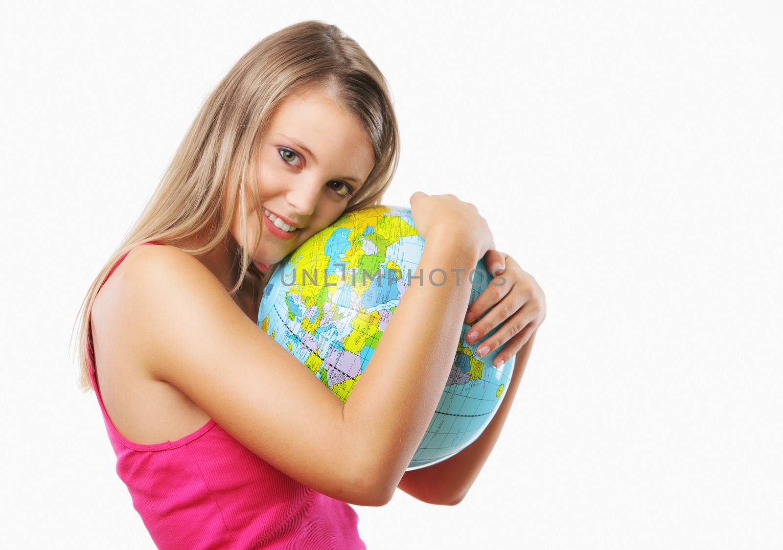 Portrait of a happy blonde girl embracing a globe against white background 