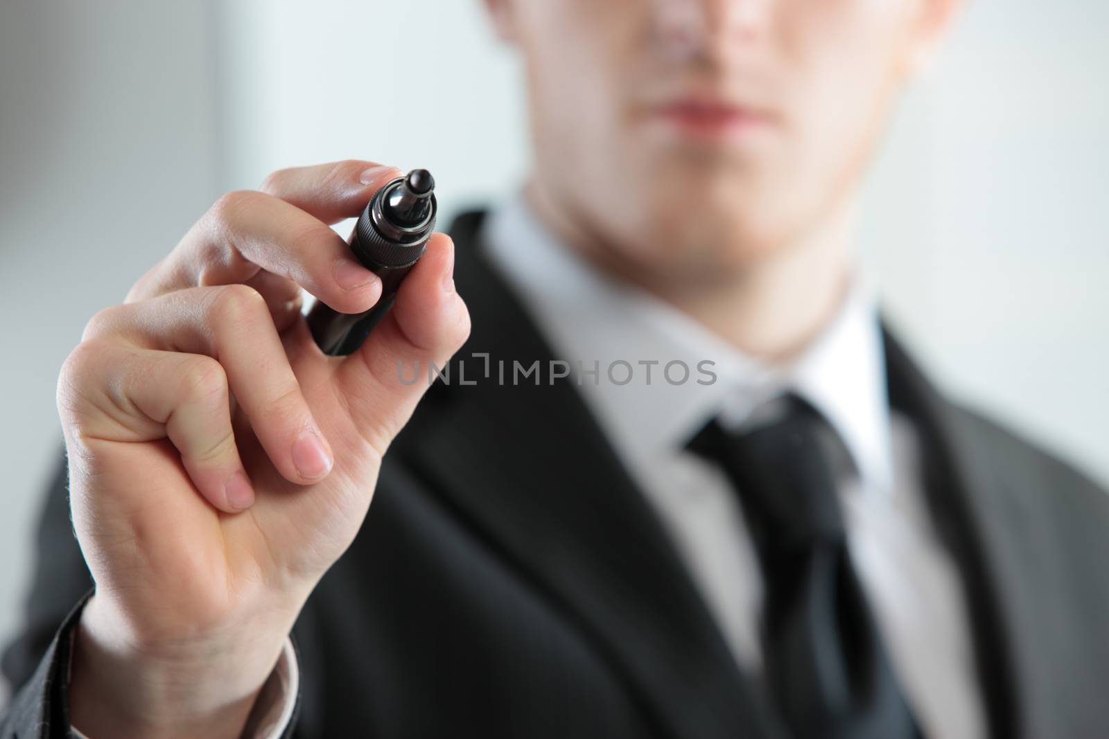 Businessman Hand holding black marker, close up