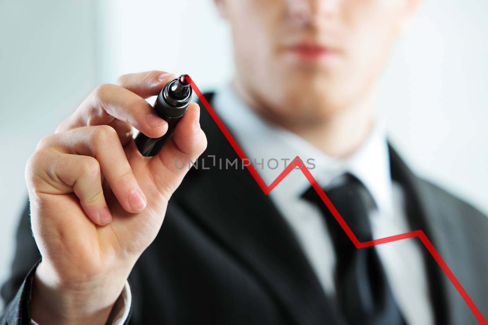 Businessman Hand drawing a graph