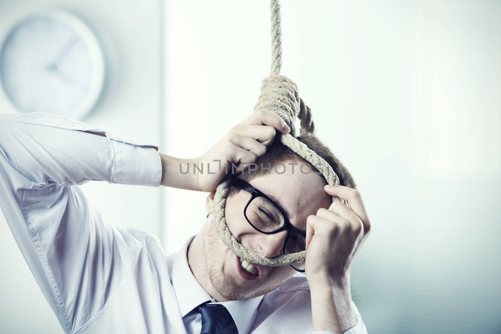 A office worker is setting up a noose
