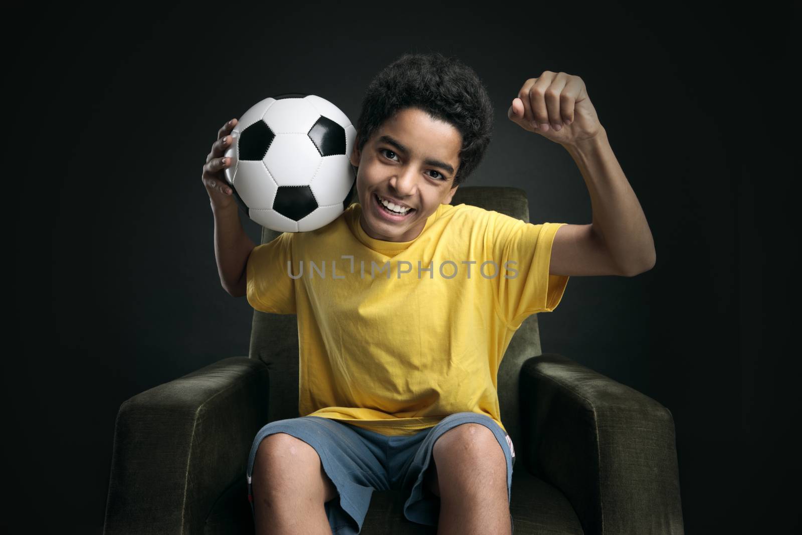 Happy young boy celebrating the victory