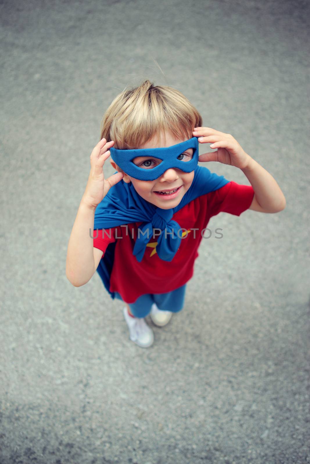 A young boy dreams of becoming a superhero.