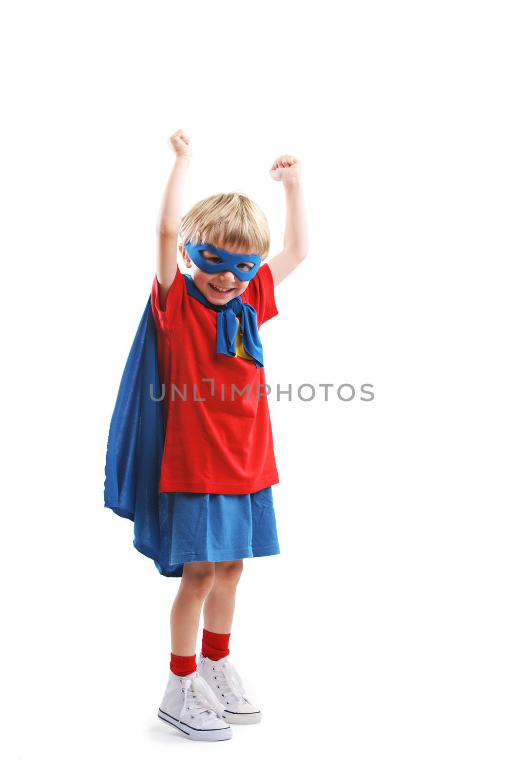 Portrait of a cheerful little boy superhero 