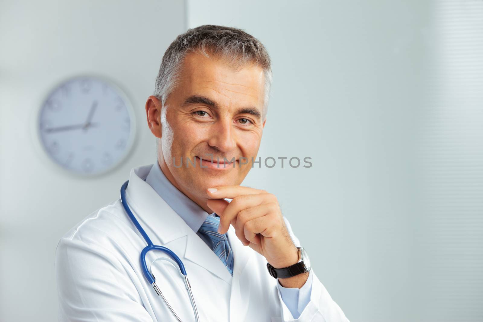 Portrait of a handsome male doctor smiling at camera