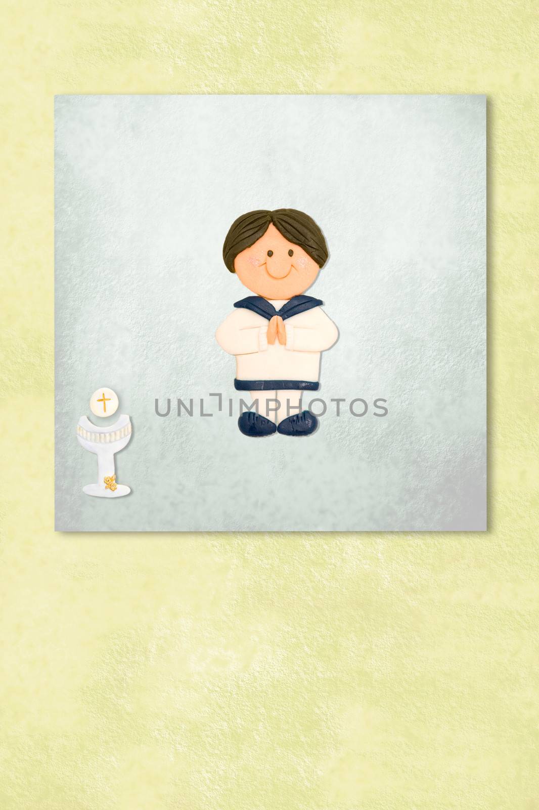  boy celebrating first communion invitation card, Background with copy space.