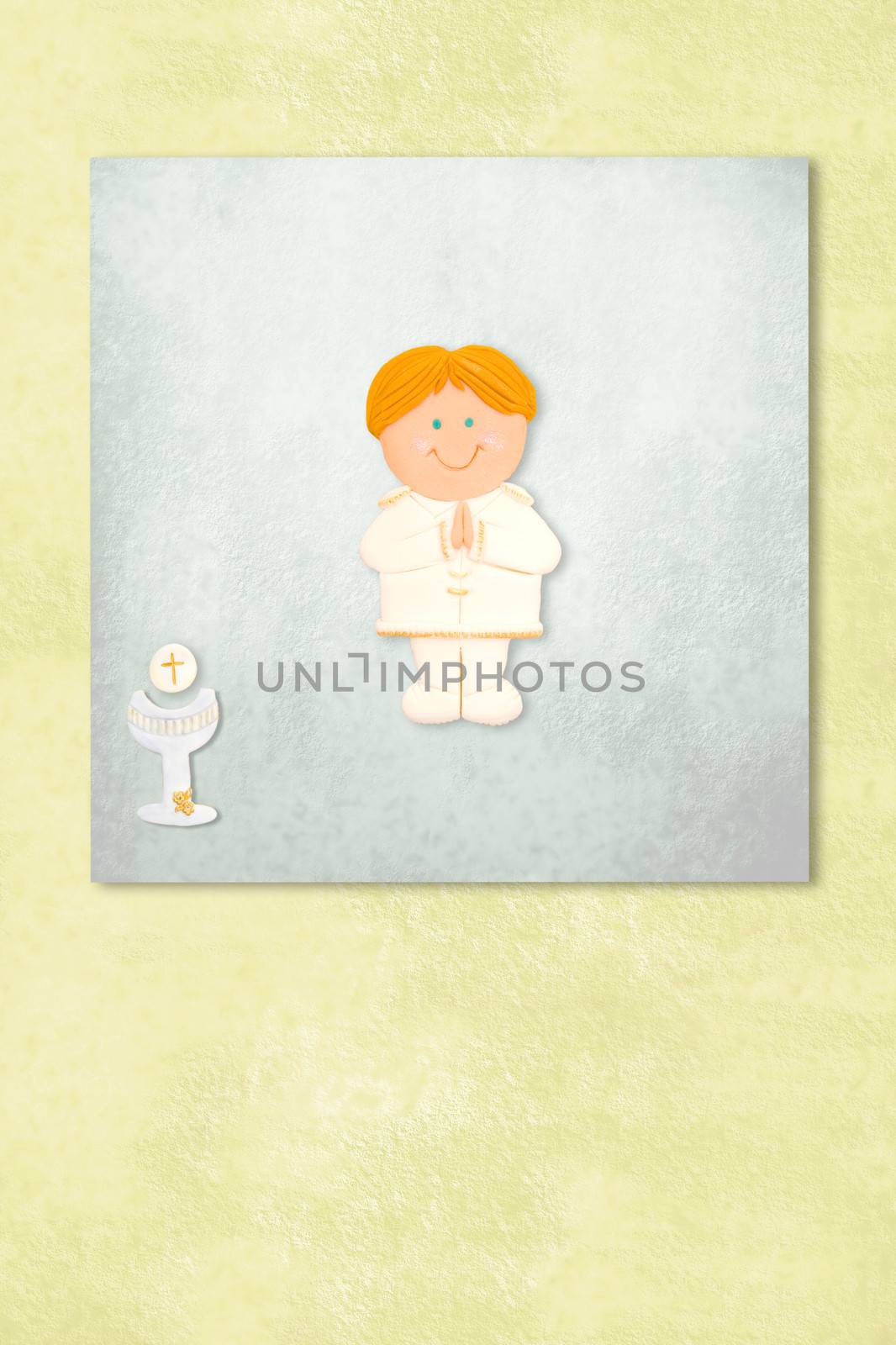  boy celebrating first communion invitation card, Background with copy space.