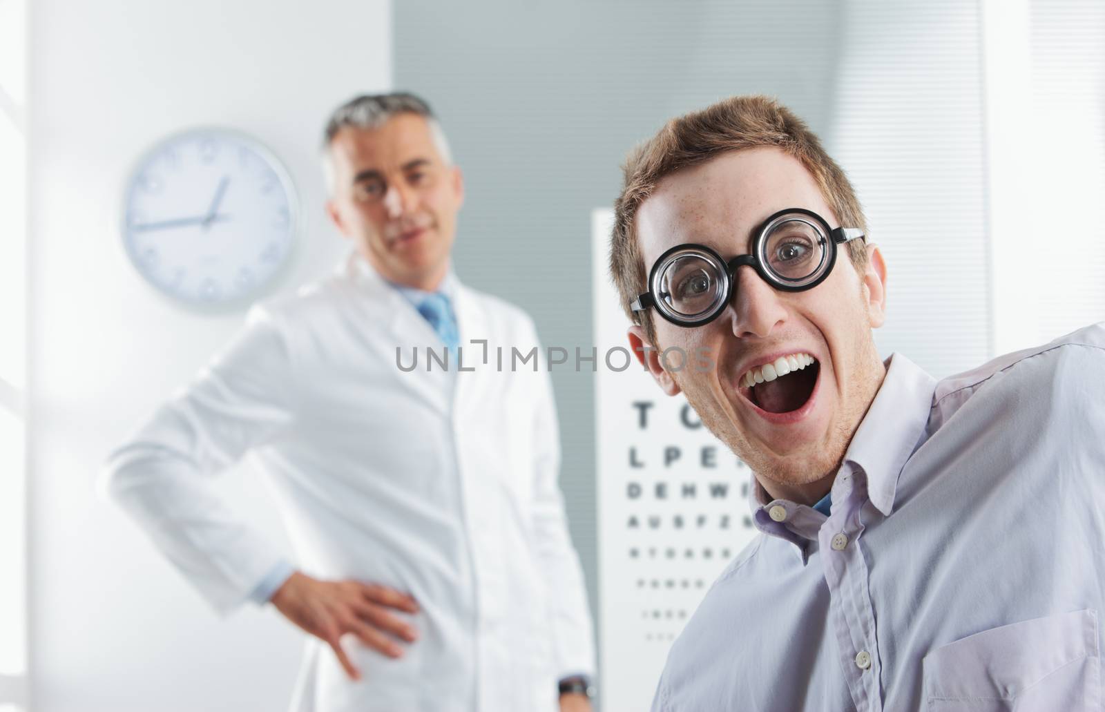 Oculist exam, young nerd patient having fun