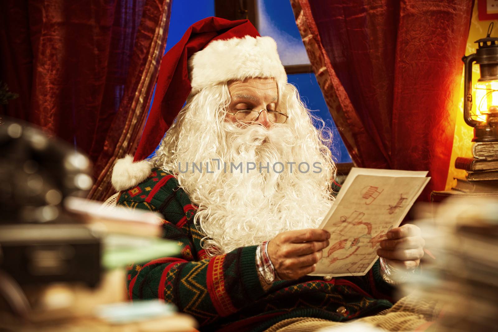 Portrait of Santa Claus reading a Christmas letter