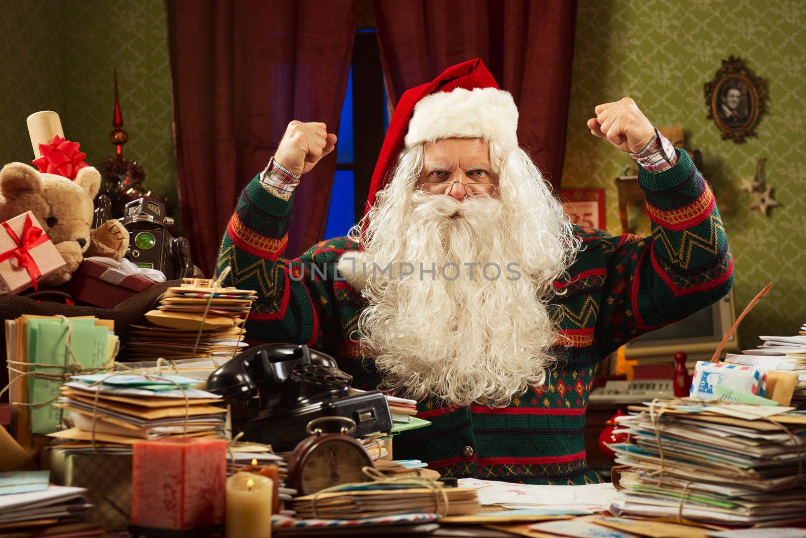 Santa Claus showing his biceps