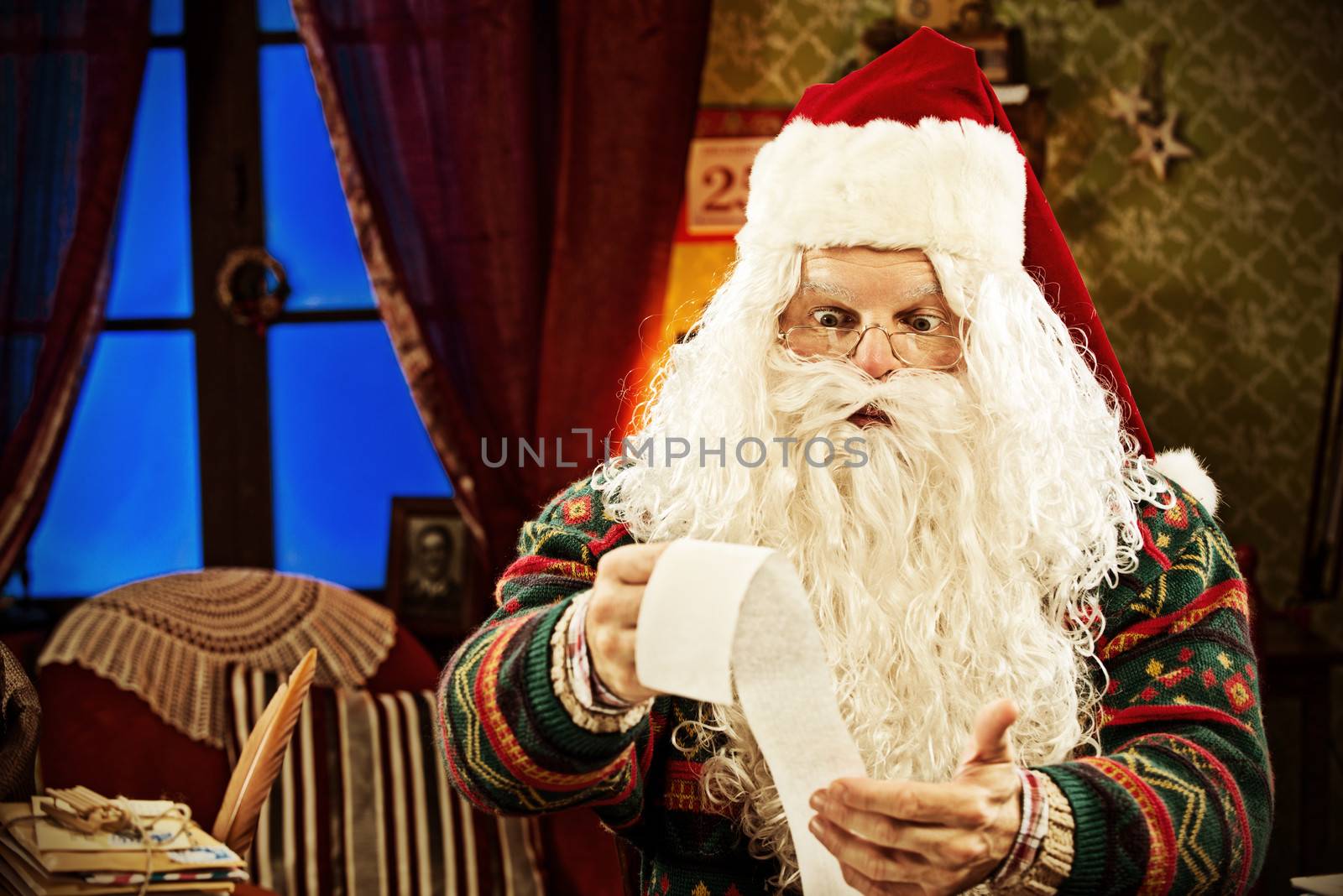 Santa Claus accountant going over figures and very upset by the result.