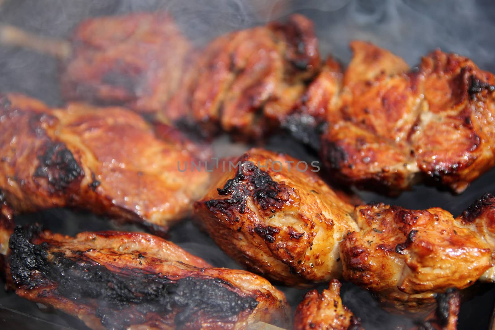 delicious fried pieces of meat cooked over charcoal