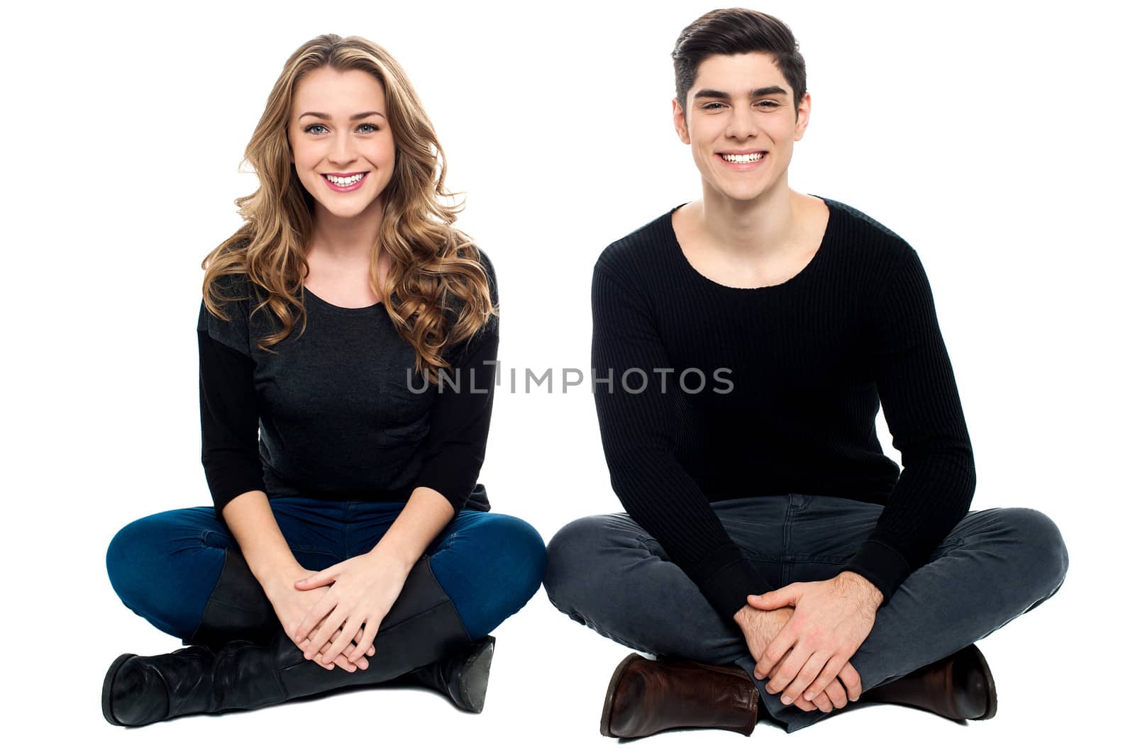 Young love couple sitting on the floor by stockyimages