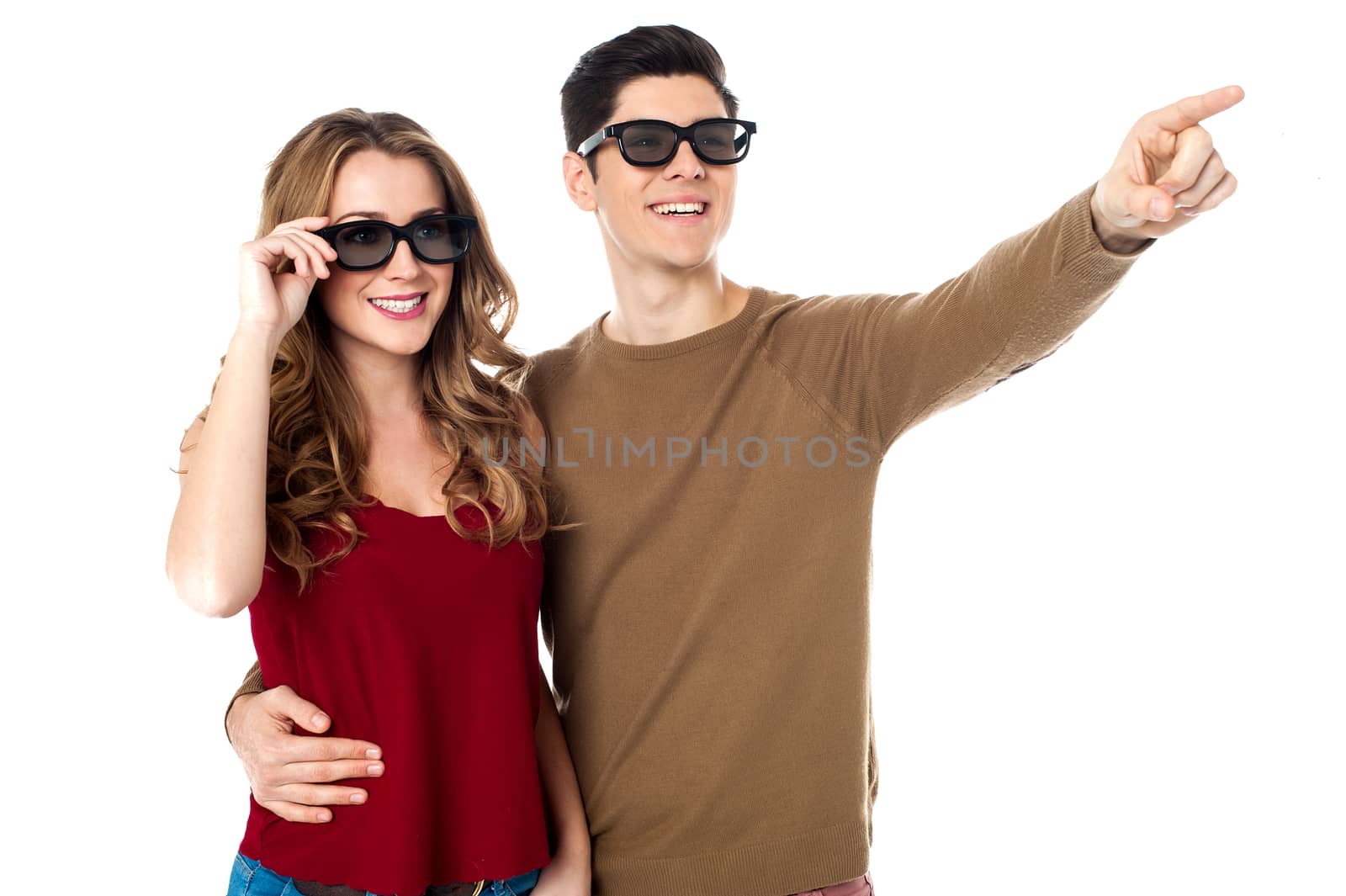 Love couple in trendy shades. Guy pointing.