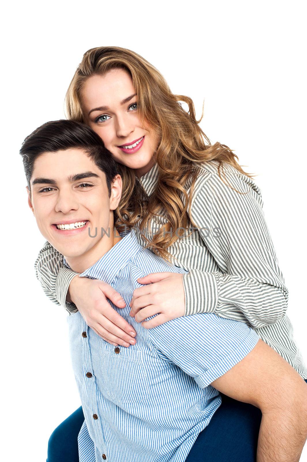 Girl enjoying piggy ride on her boyfriend's back