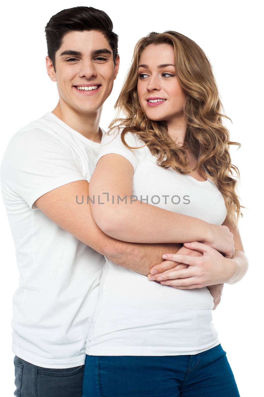 Handsome young man embracing his girlfriend
