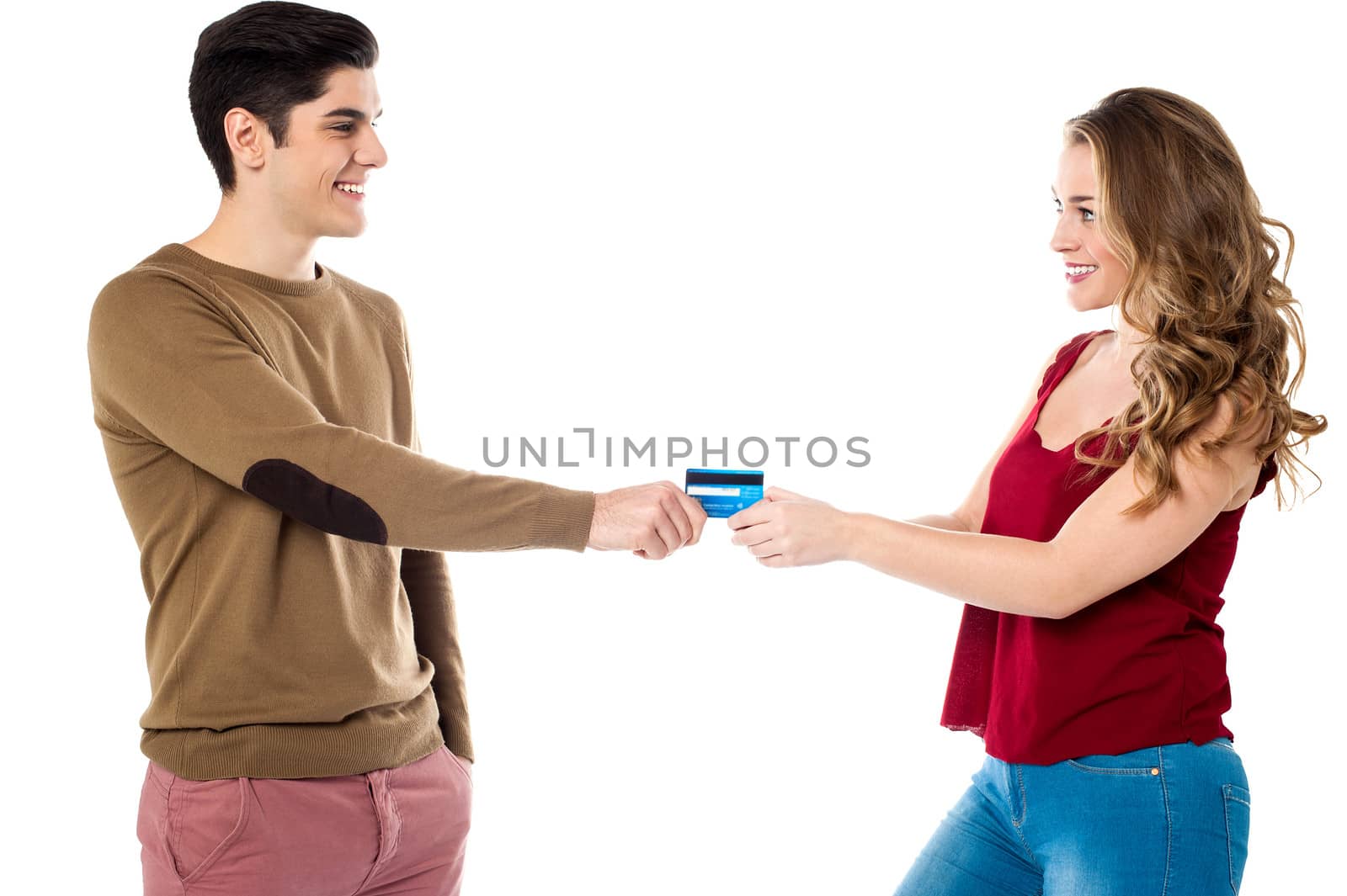 Girlfriend sweetly snatching credit card by stockyimages