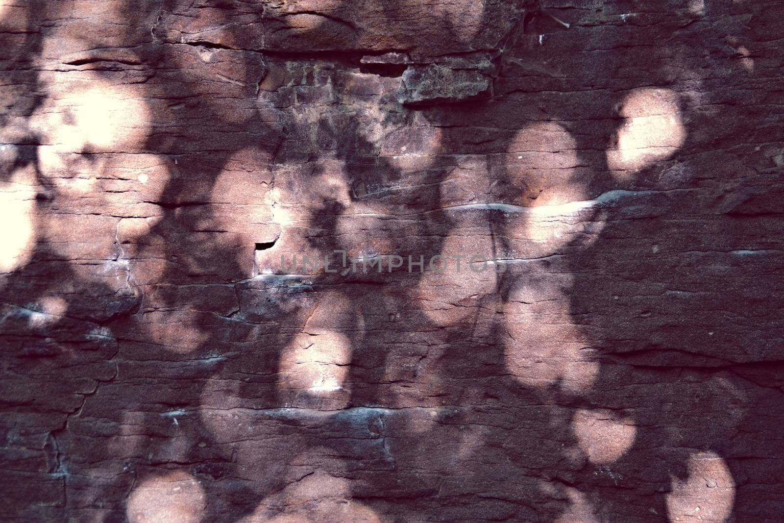 sandstone rocks with reflections of sunlight circular form