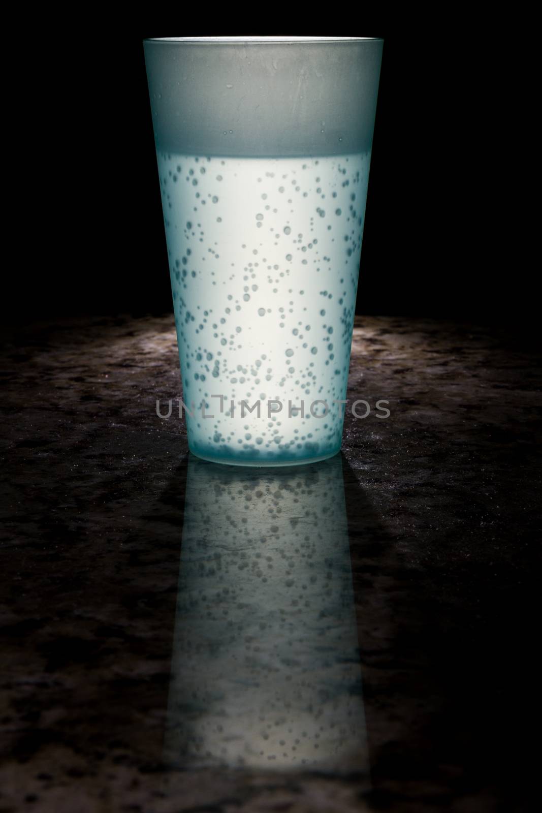 Drink lit up against a dark background