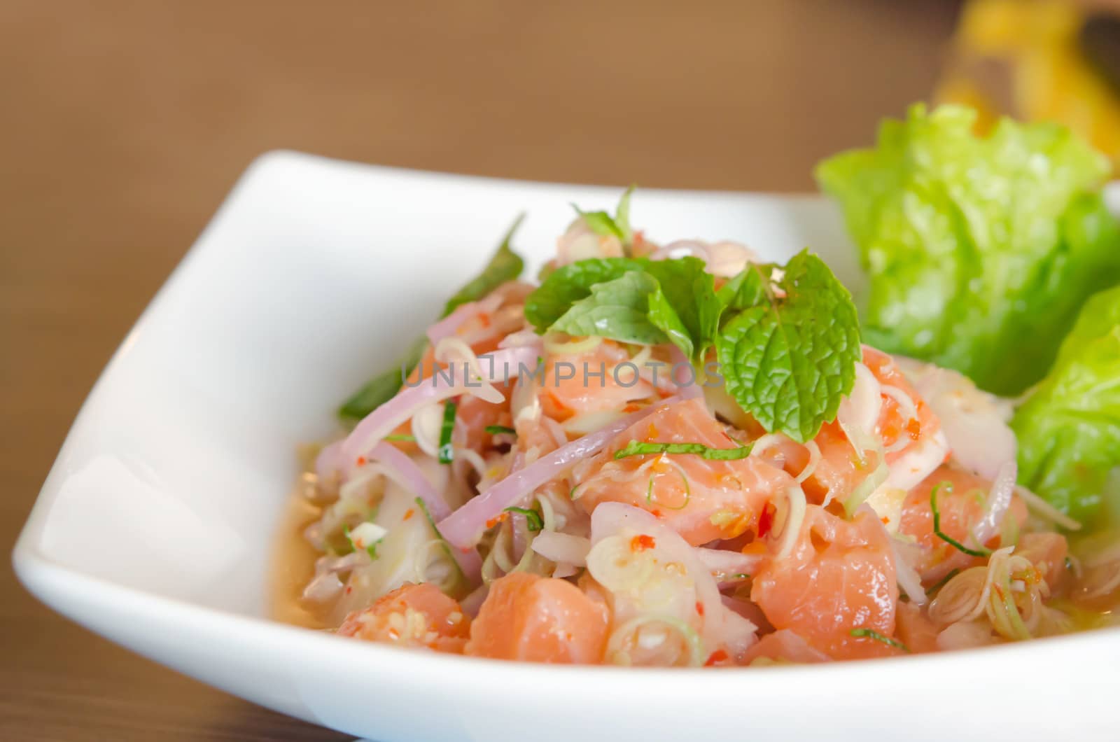close up of spicy salmon salad with  mixed  vegetable