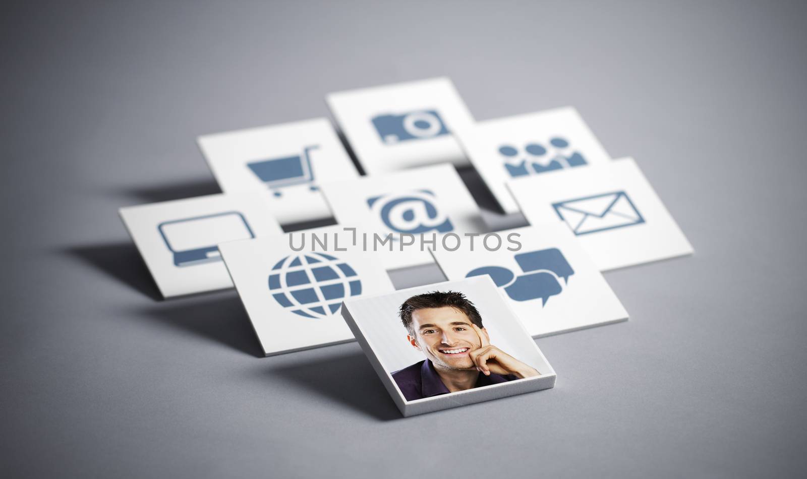 Portrait of young smiling man with tecnology icons