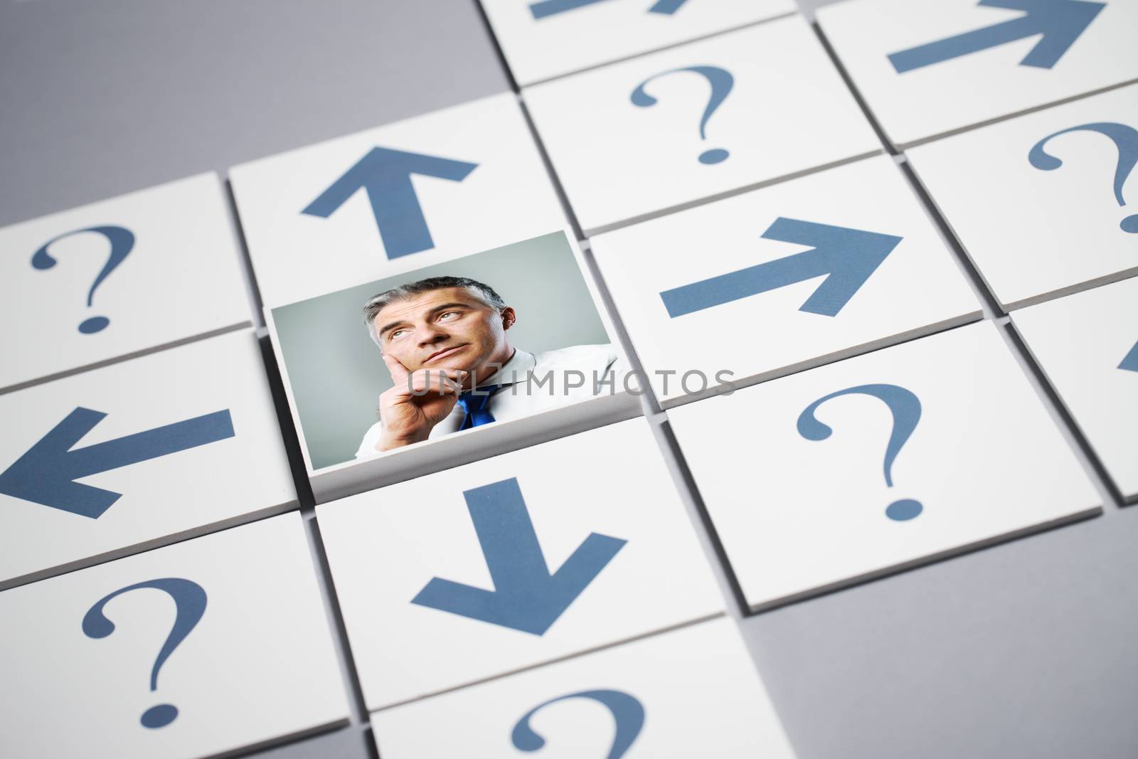 Senior businessman thinking surrounded by question marks and arrows