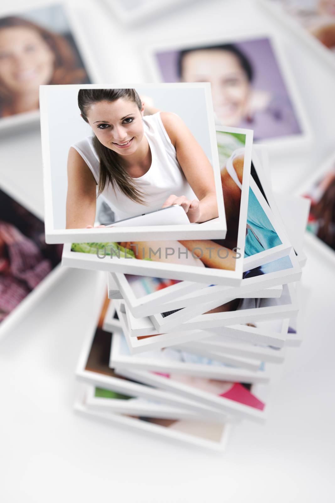 Conceptual portraits of a group of people with smiling woman using digital tablet