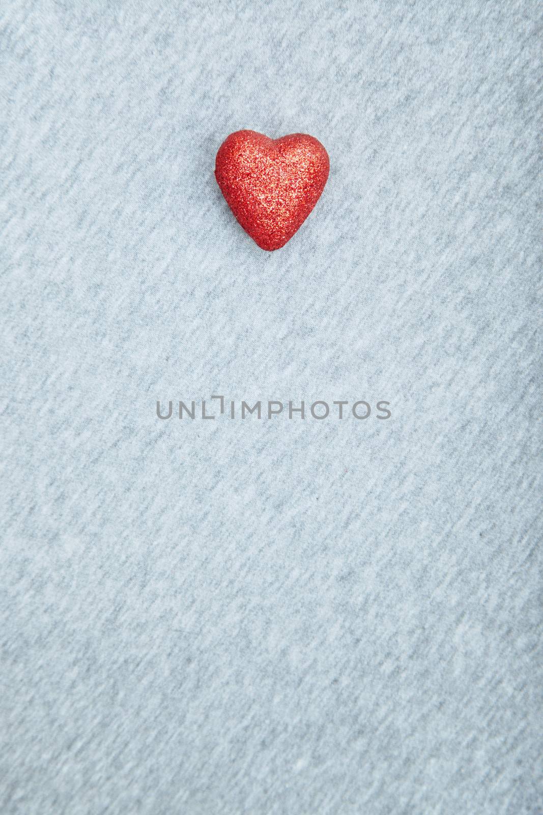 Red heart of love on a textured background