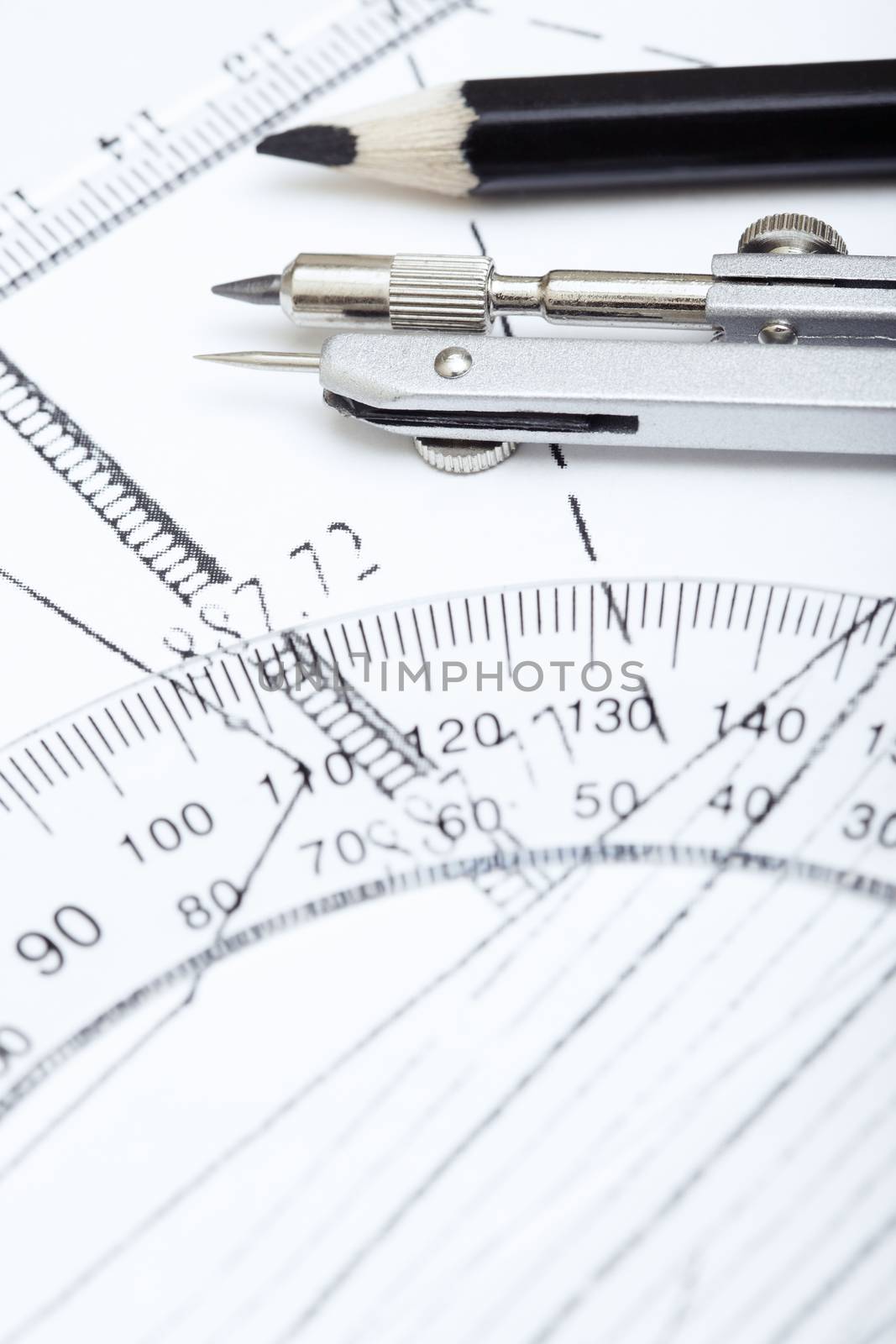 Scheme with compasses rulers and pencil. Extremely close-up photo