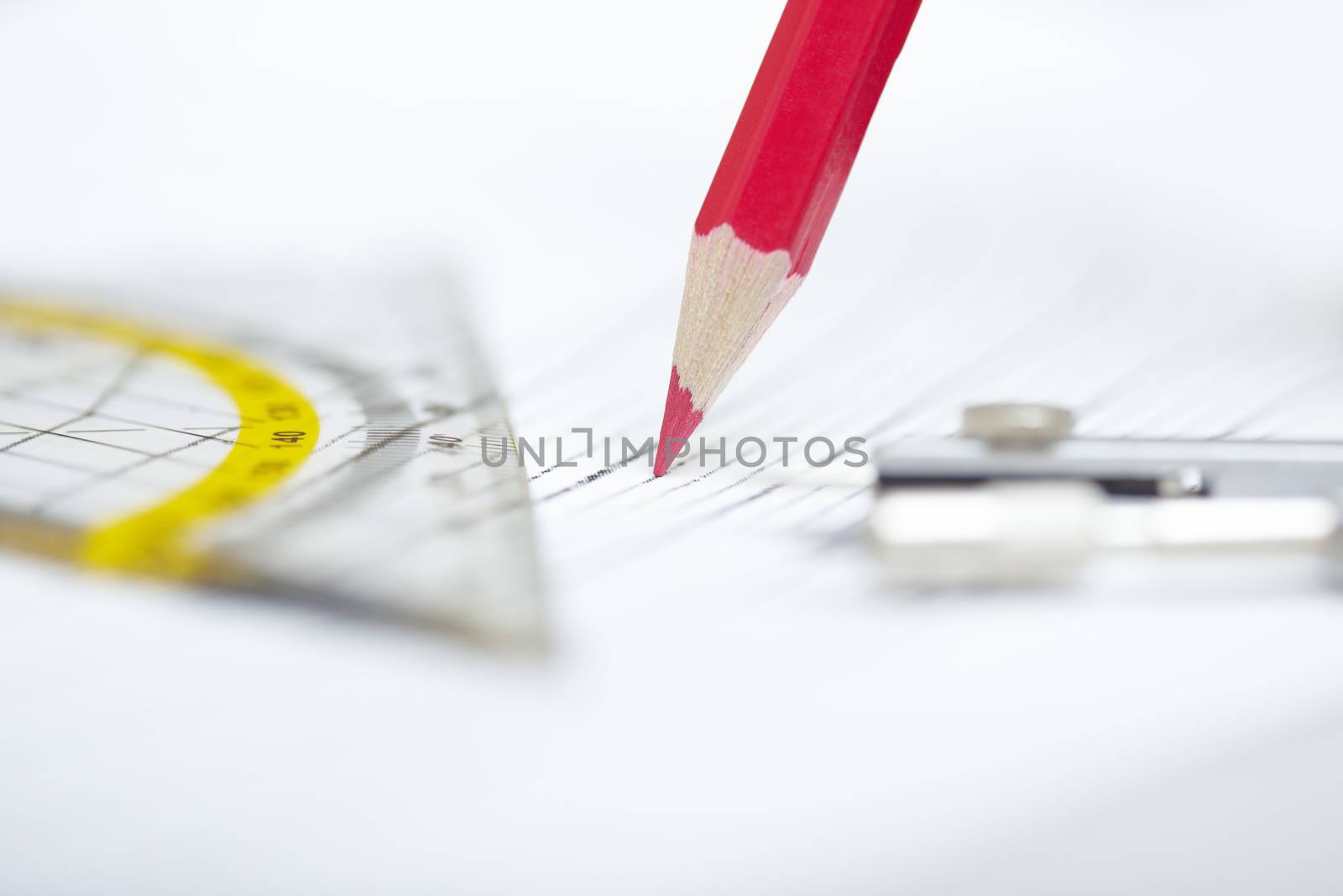 Drawing tools on a paper. Extremely close-up photo with shallow depth of field