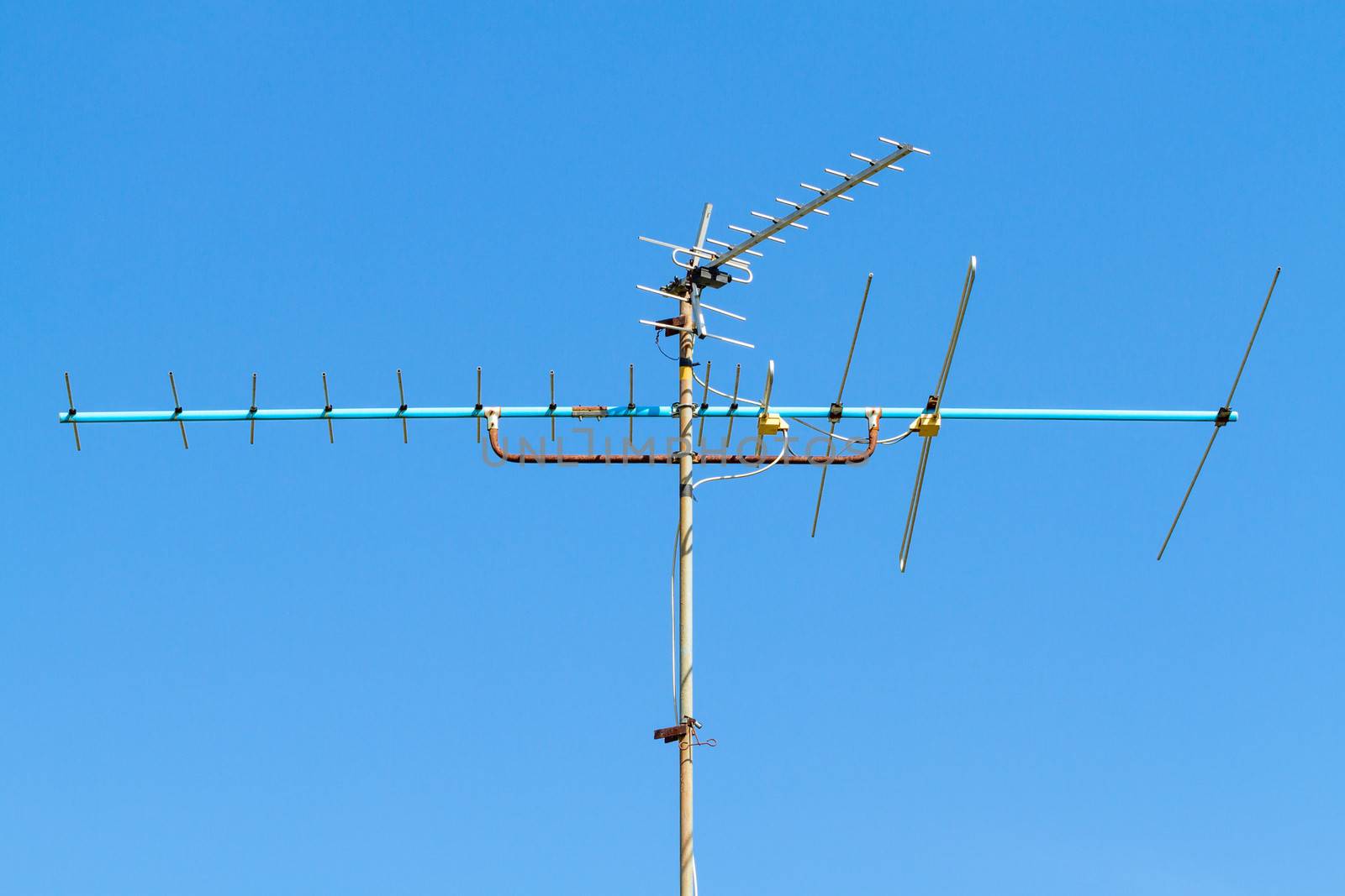 television antenna on clear blue sky