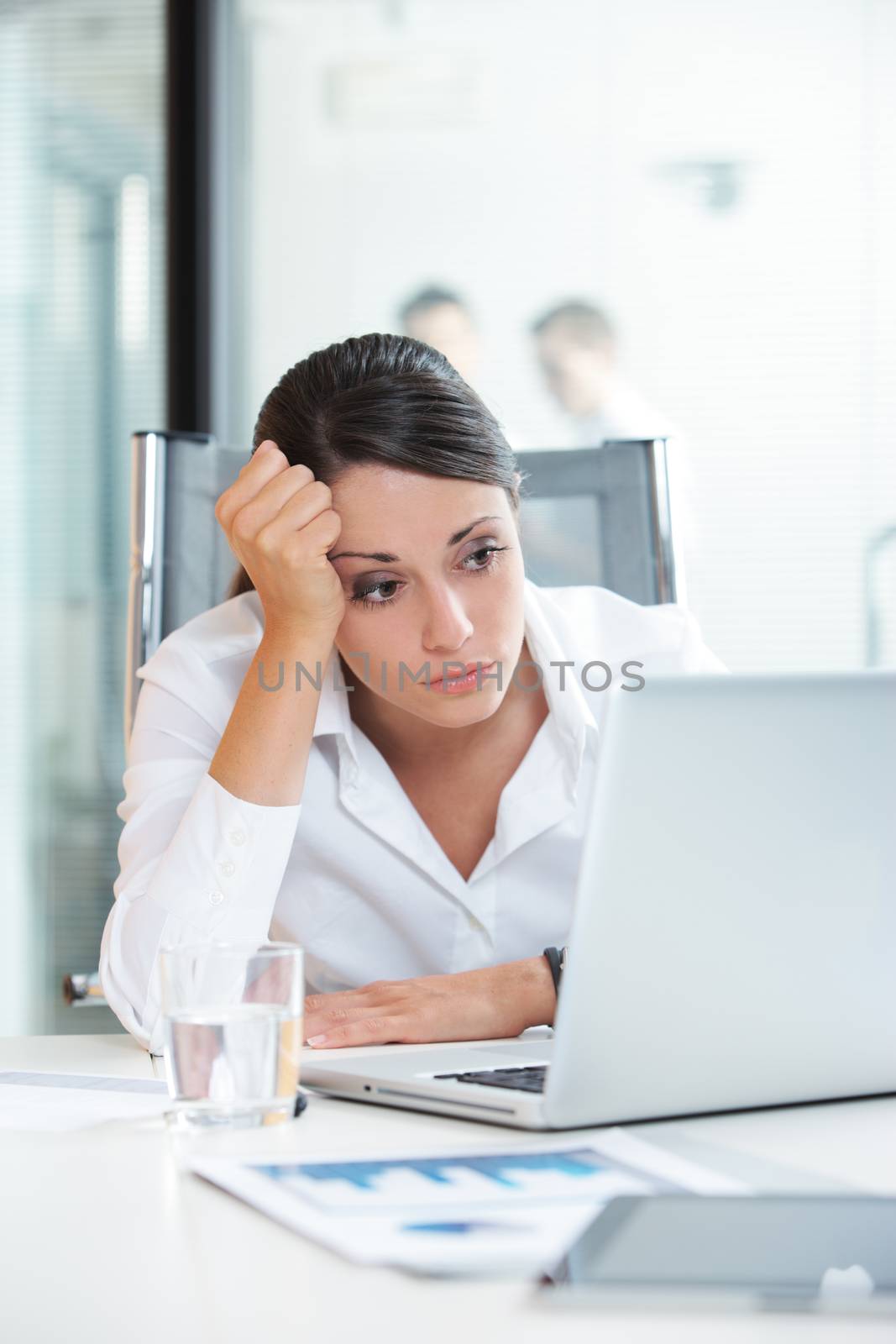Young Businesswoman unhappy at work, she is think about her problems