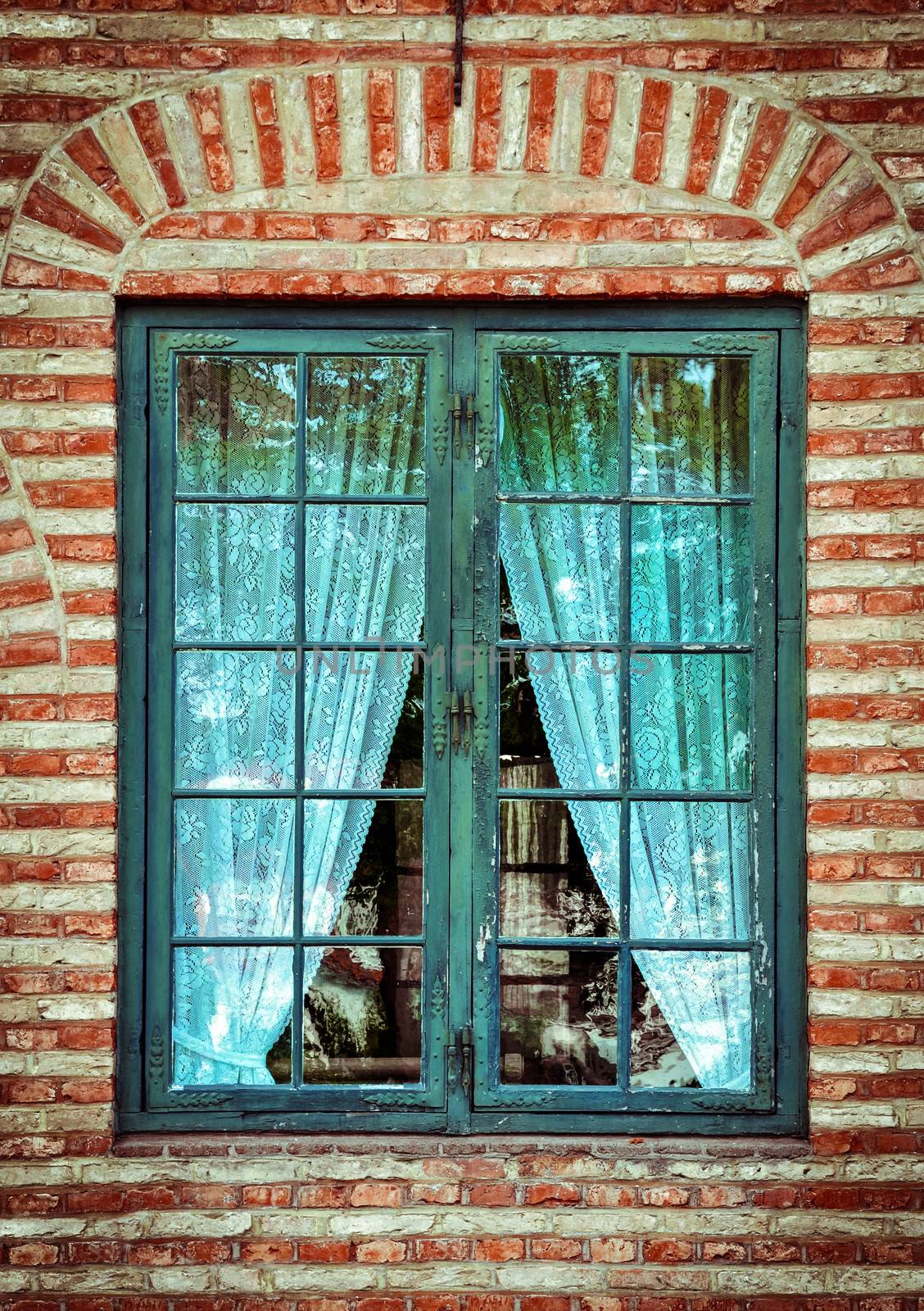 Old wooden window and with lace curtains
