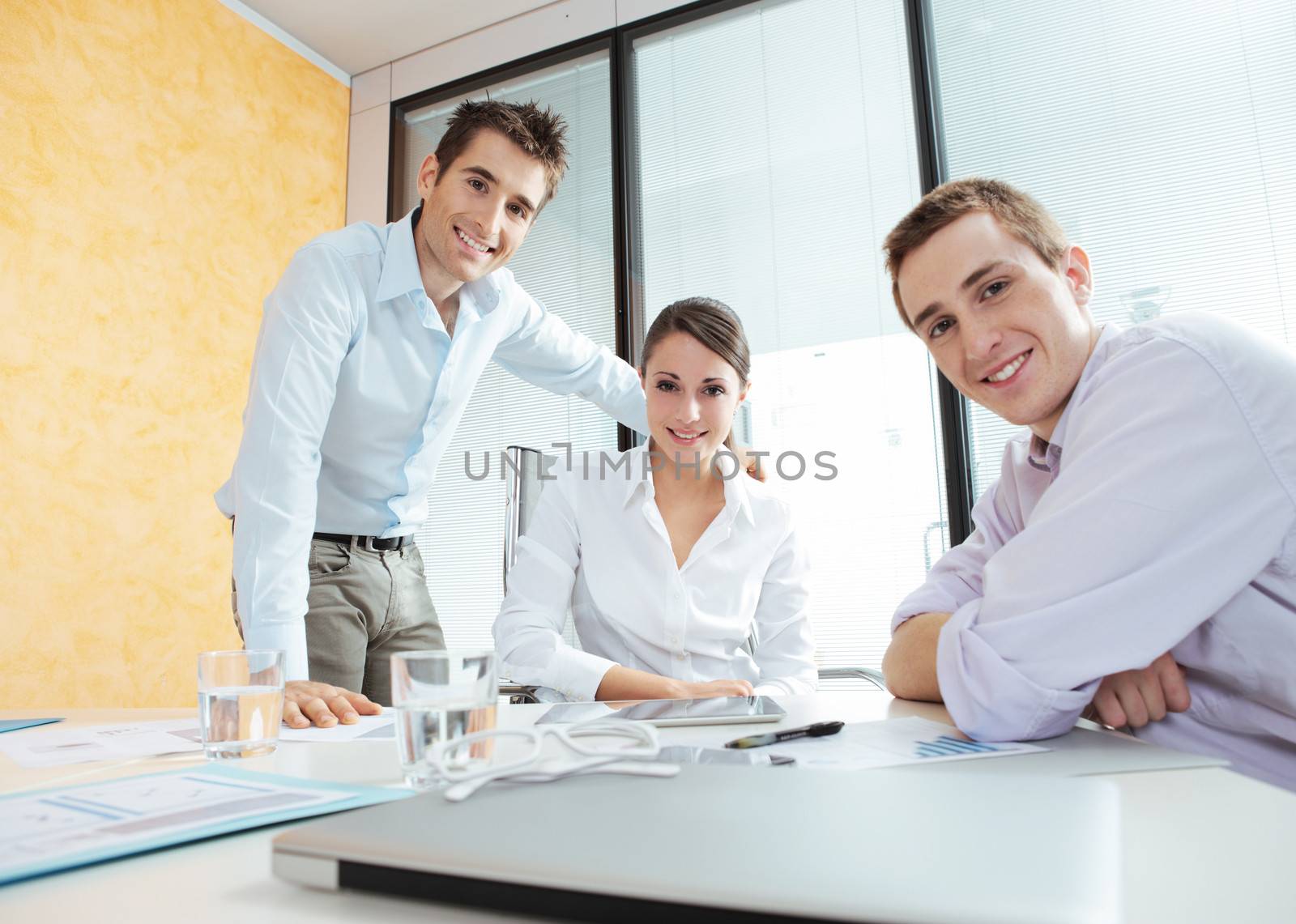 Portrait of smiling young business people in their office
