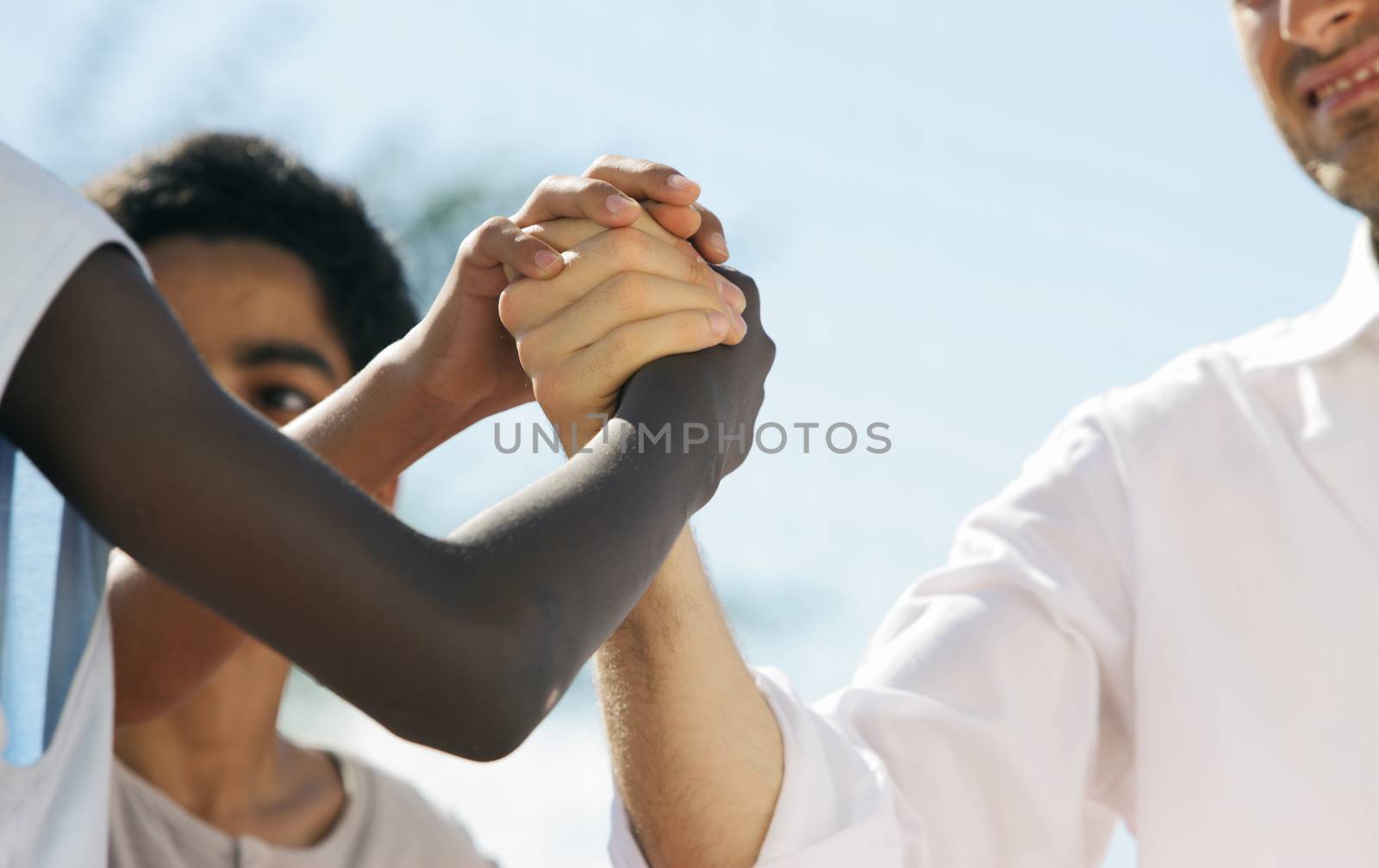 Multi-Ethnic people shaking hands, close up