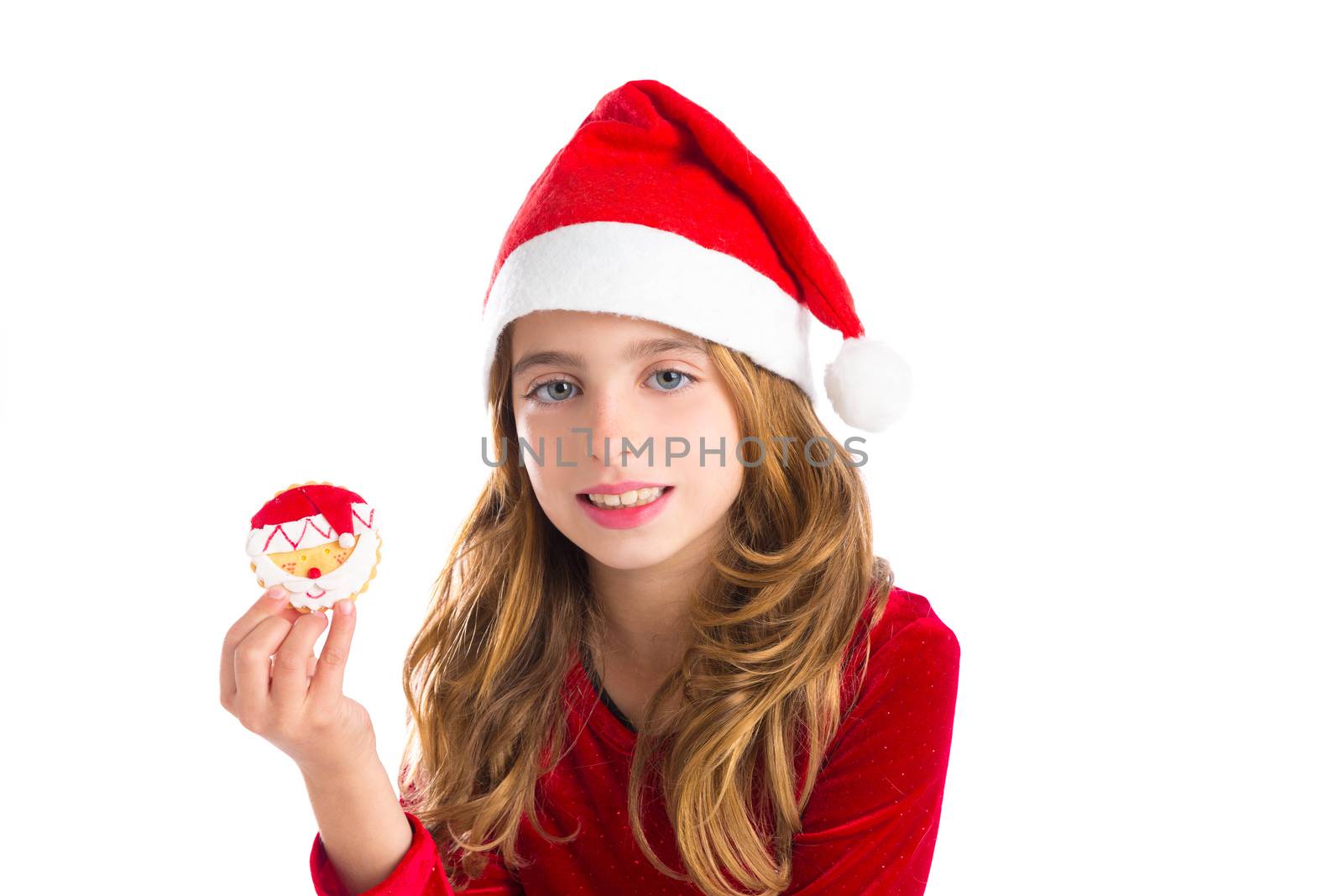 Christmas kid girl holding Xmas Santa cookie by lunamarina
