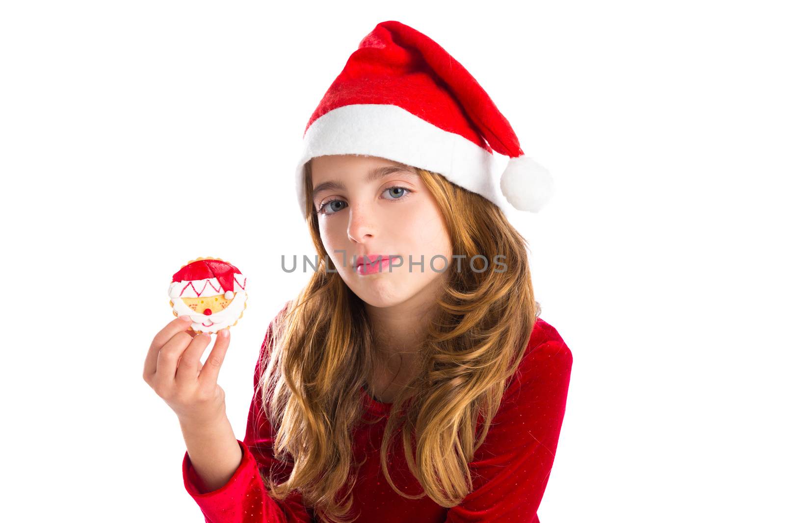 Christmas kid girl holding Xmas Santa cookie isolated on white background